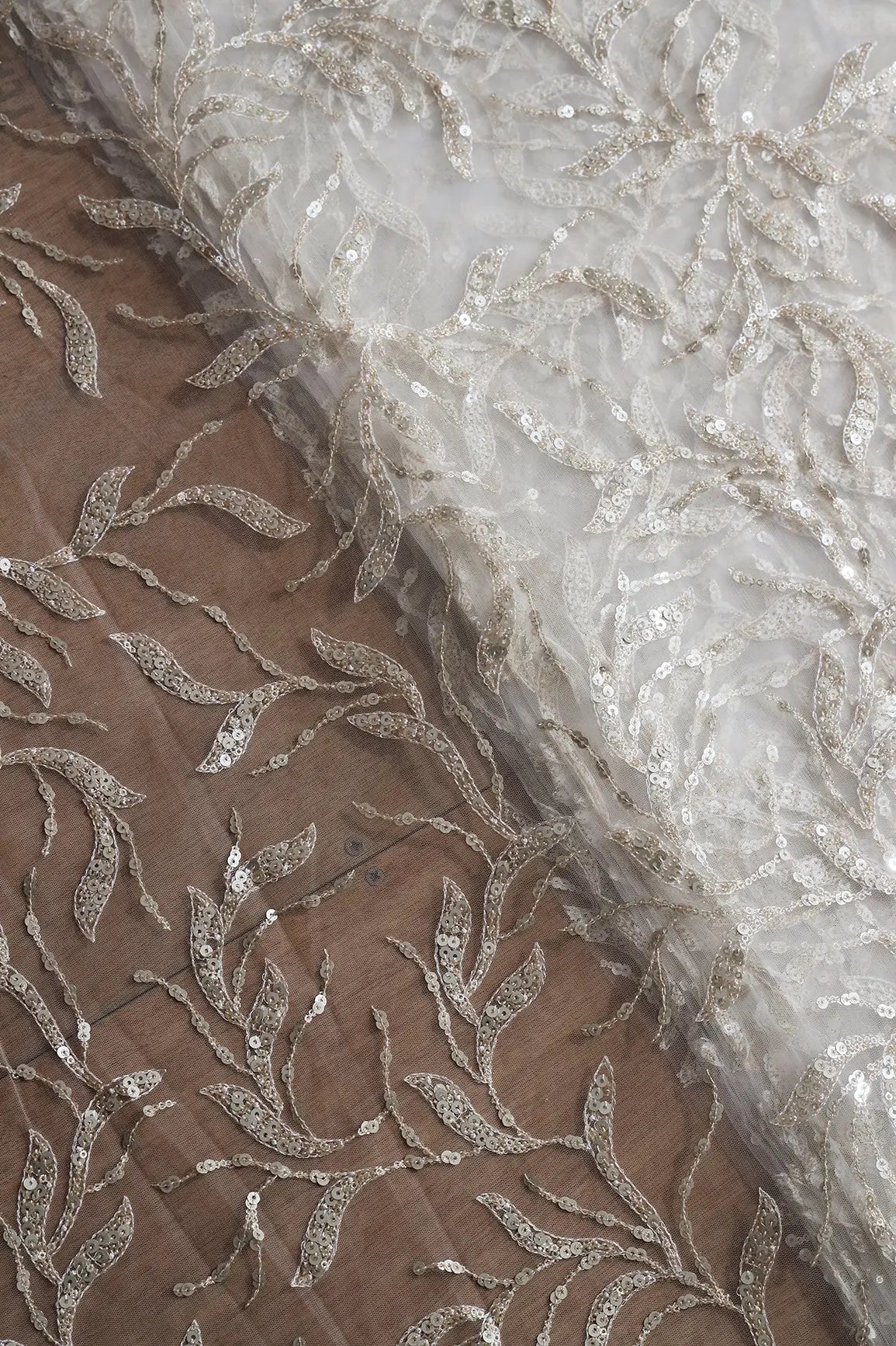 Gold And Silver Sequins Leafy Floral Embroidery On Dyeable White Soft Net Fabric