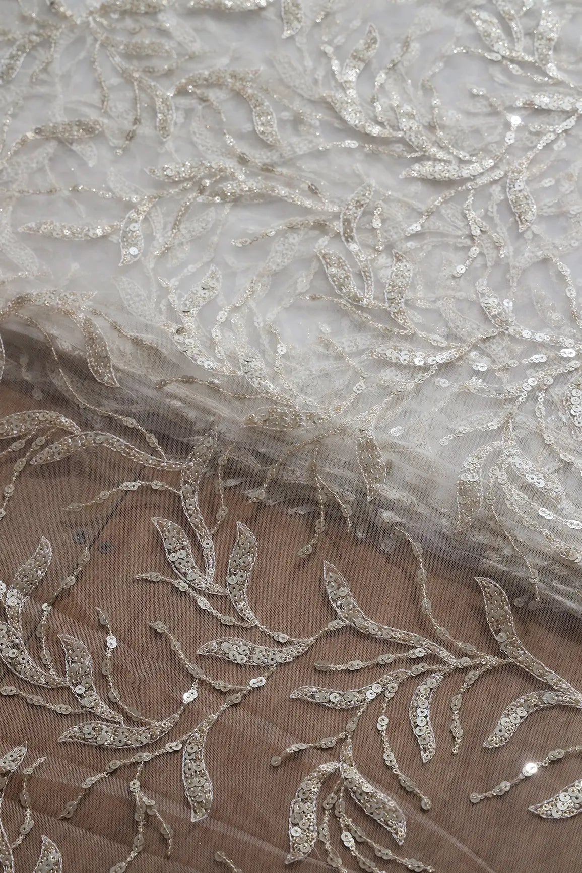 Gold And Silver Sequins Leafy Floral Embroidery On Dyeable White Soft Net Fabric