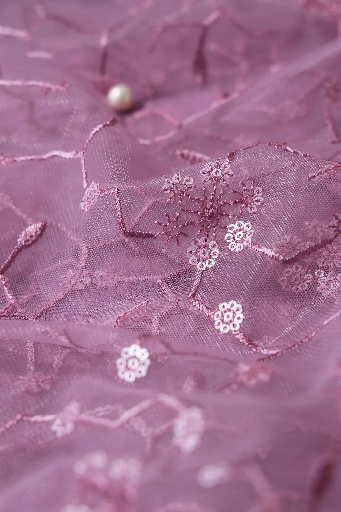 Beautiful Water Sequins Small Floral Embroidery On Mauve Soft Net Fabric