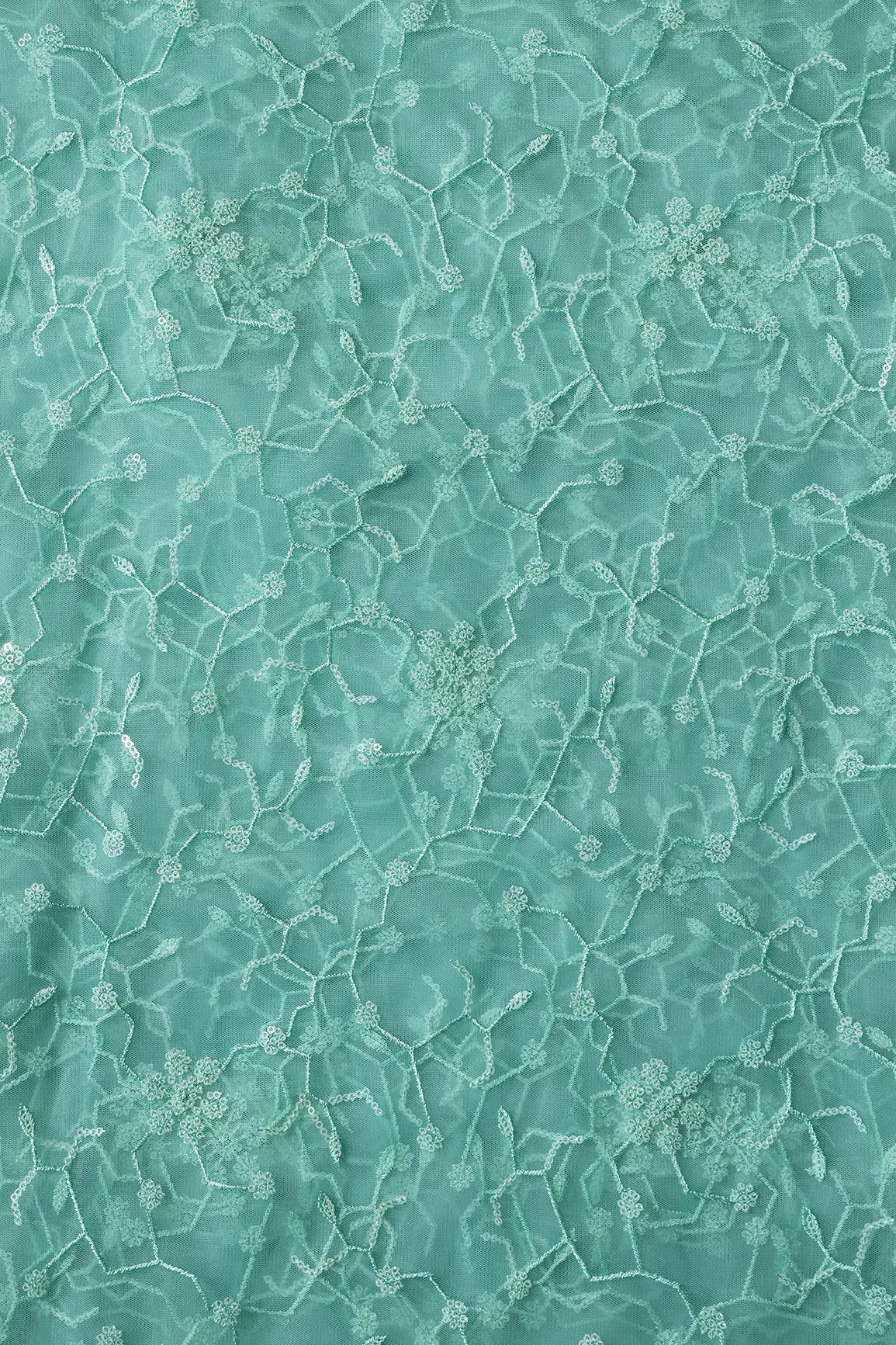 Beautiful Water Sequins Small Floral Embroidery On Sea Green Soft Net Fabric