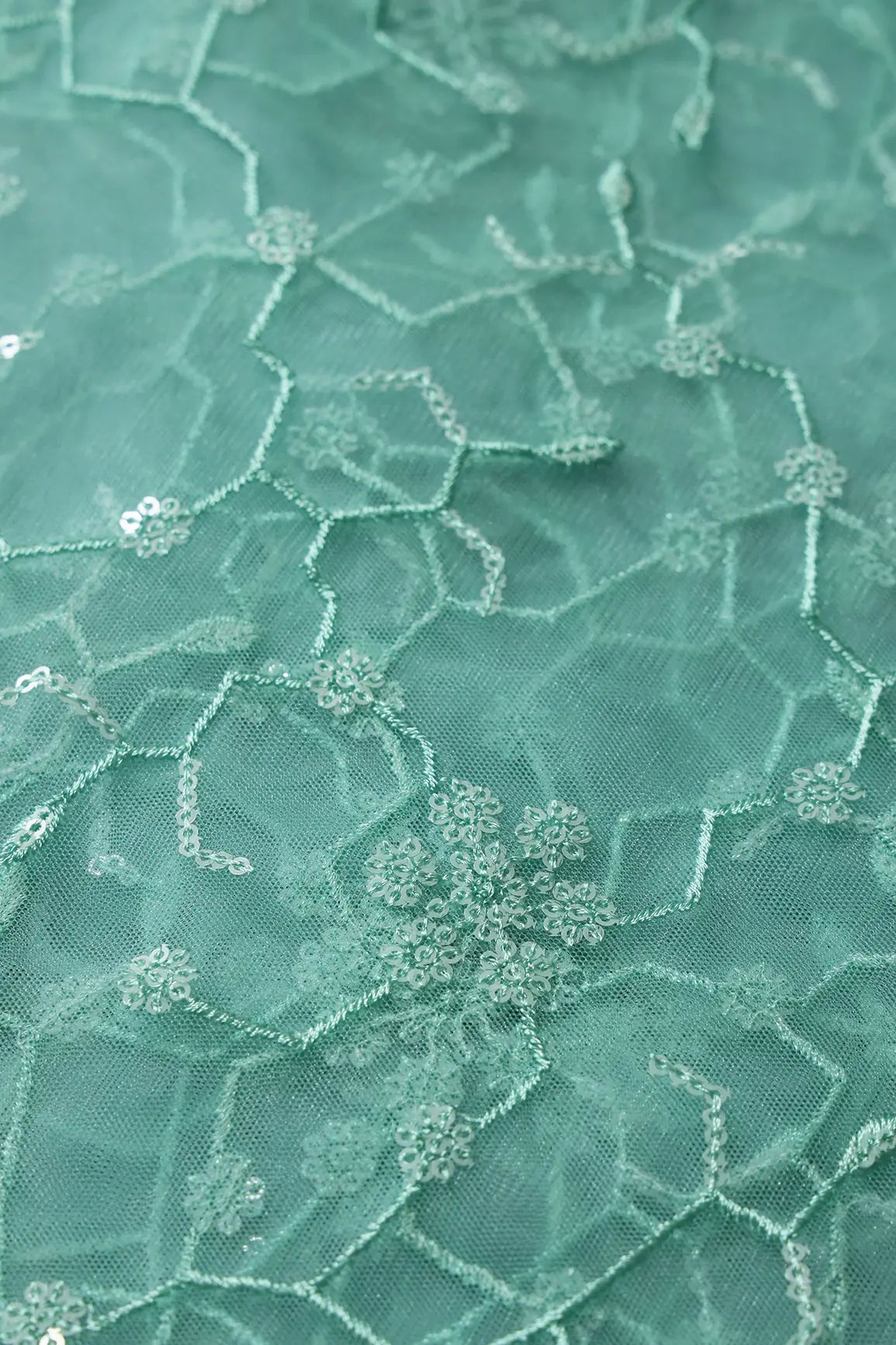 Beautiful Water Sequins Small Floral Embroidery On Sea Green Soft Net Fabric