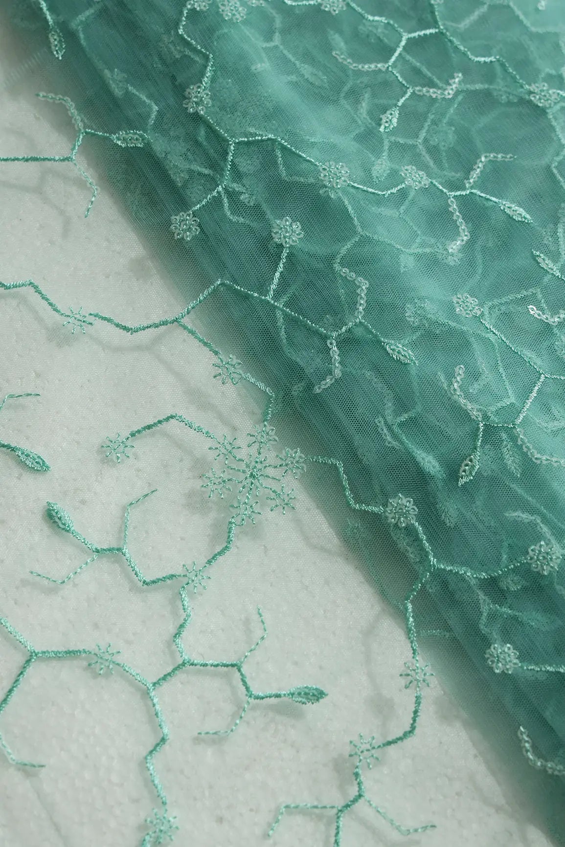 Beautiful Water Sequins Small Floral Embroidery On Sea Green Soft Net Fabric