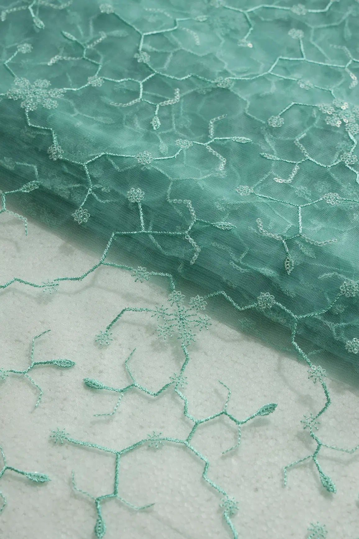 Beautiful Water Sequins Small Floral Embroidery On Sea Green Soft Net Fabric