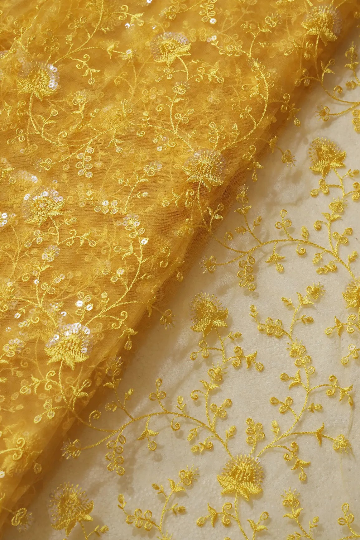 Yellow Thread With Water Sequins Floral Embroidery On Yellow Soft Net Fabric