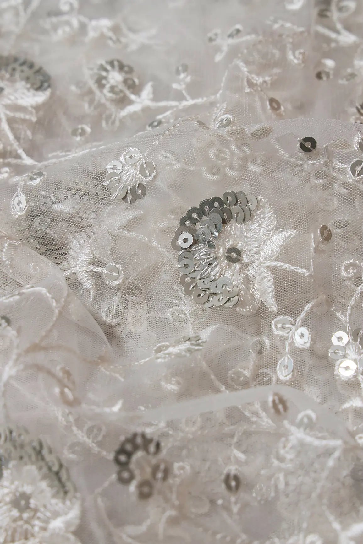 White Thread With Silver Sequins Floral Embroidery On White Dyeable Soft Net Fabric