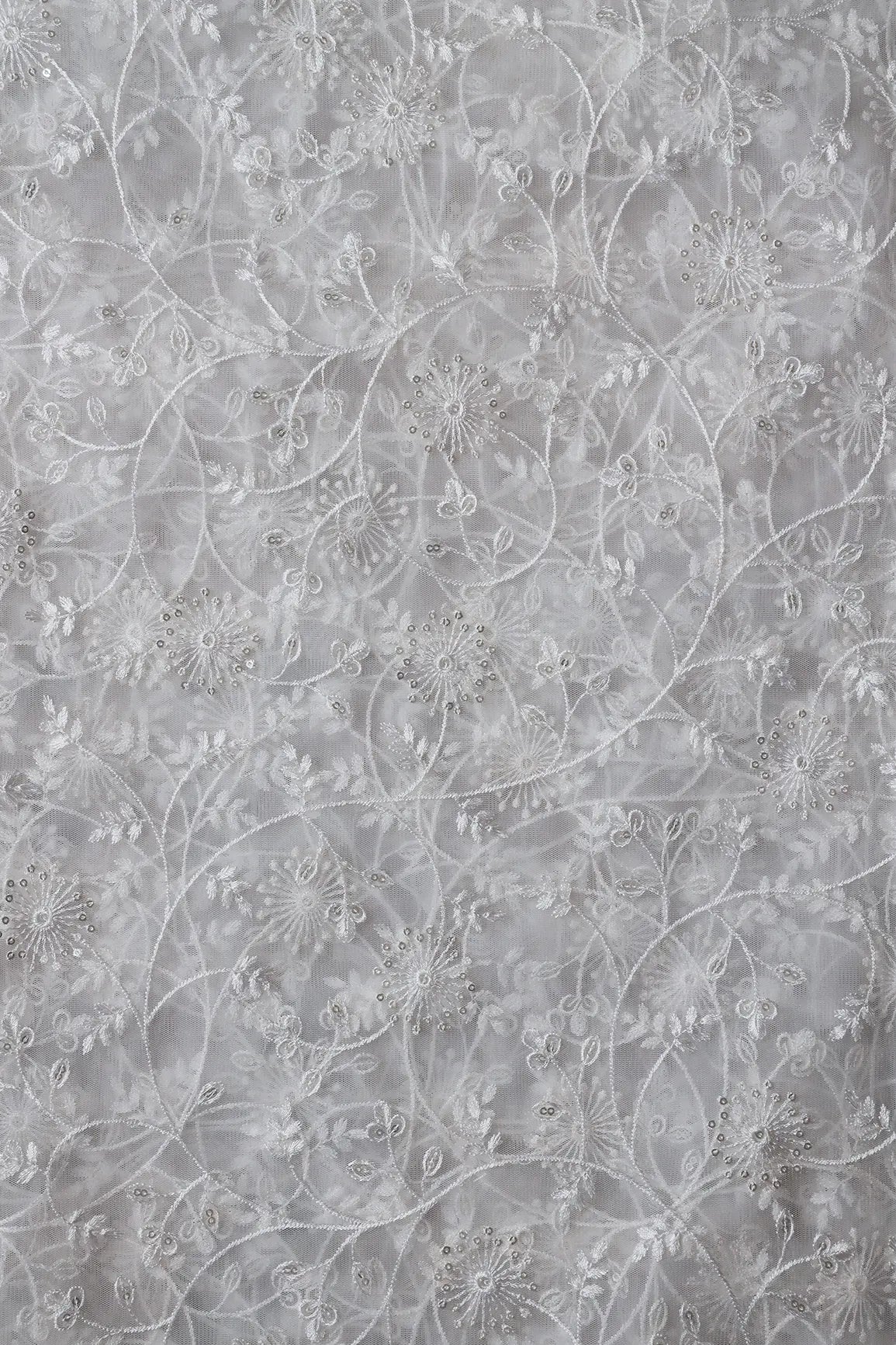 Silver Sequins With White Thread Floral Embroidery On White Dyeable Soft Net Fabric