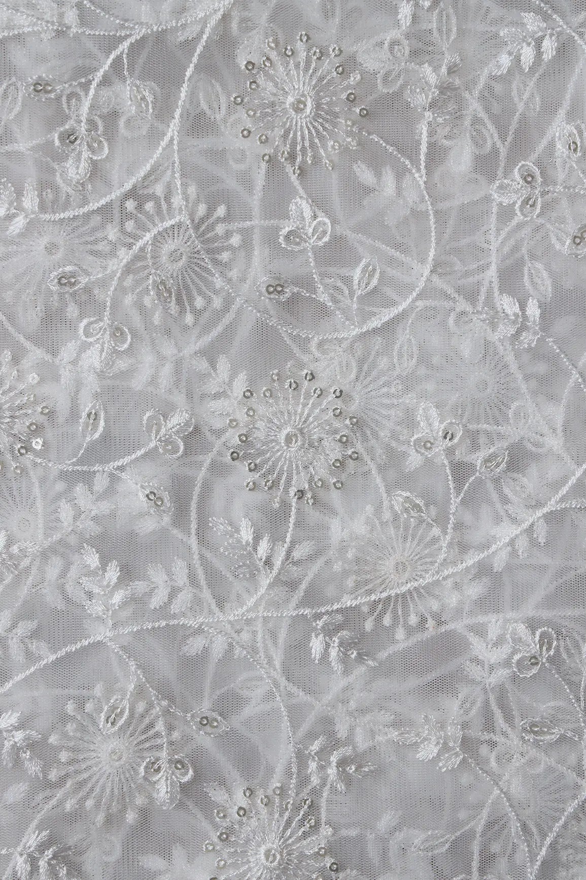 Silver Sequins With White Thread Floral Embroidery On White Dyeable Soft Net Fabric