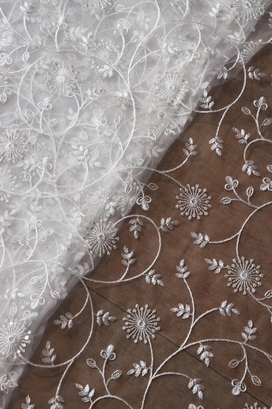 Silver Sequins With White Thread Floral Embroidery On White Dyeable Soft Net Fabric