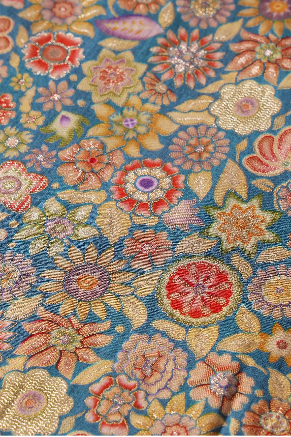 Positional Floral Print On Blue Viscose Dola Silk Jacquard Fabric