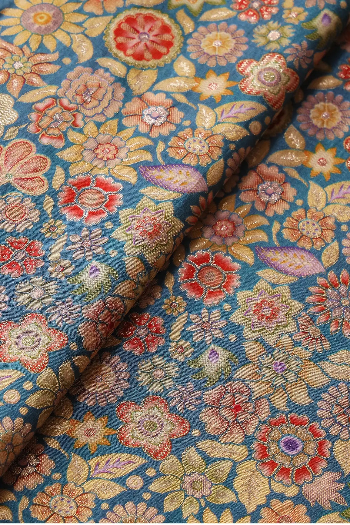 Positional Floral Print On Blue Viscose Dola Silk Jacquard Fabric