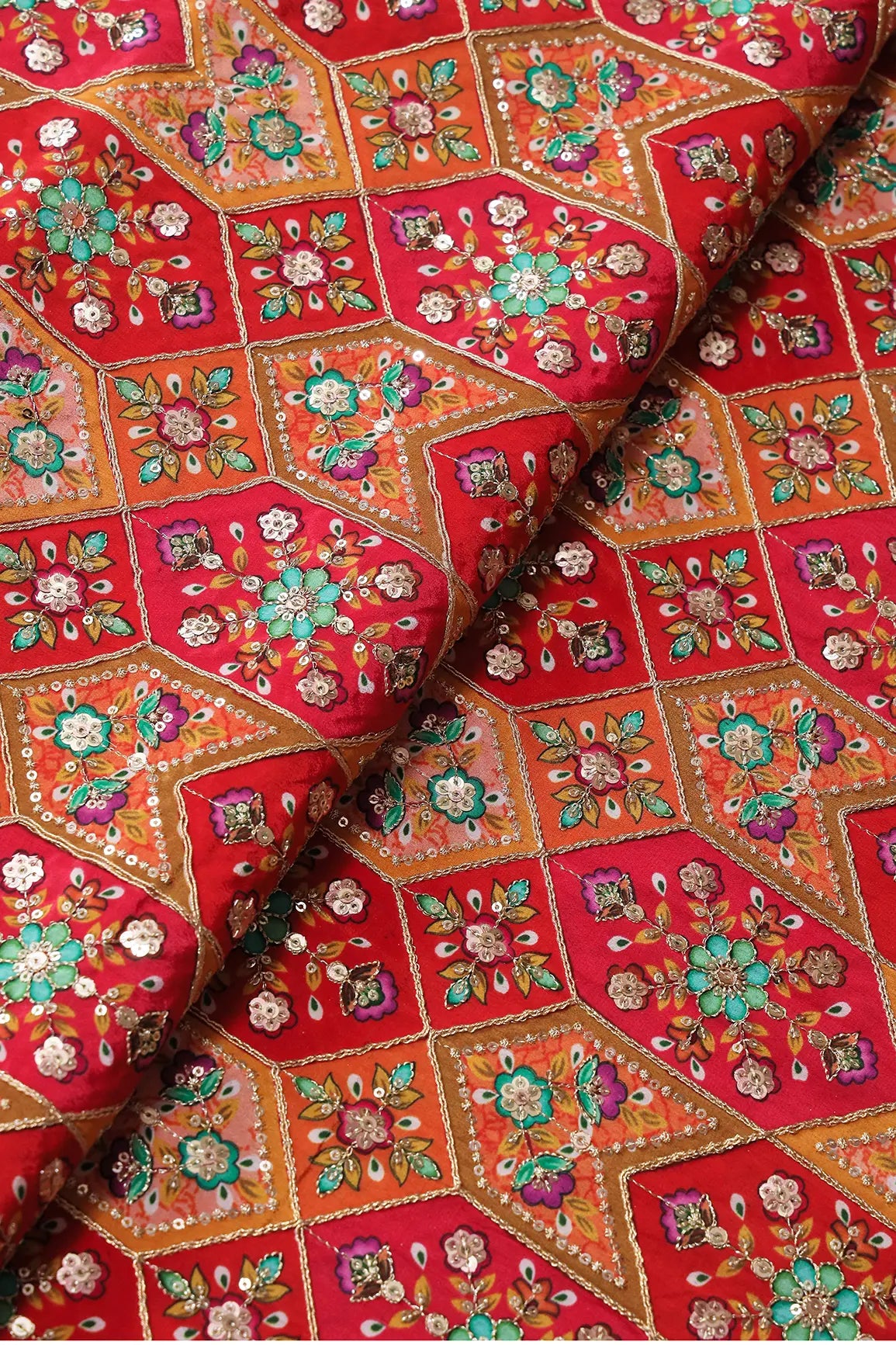 Red And Orange Traditional Positional Print With Gold Zari And Sequins Embroidery On Crepe Fabric