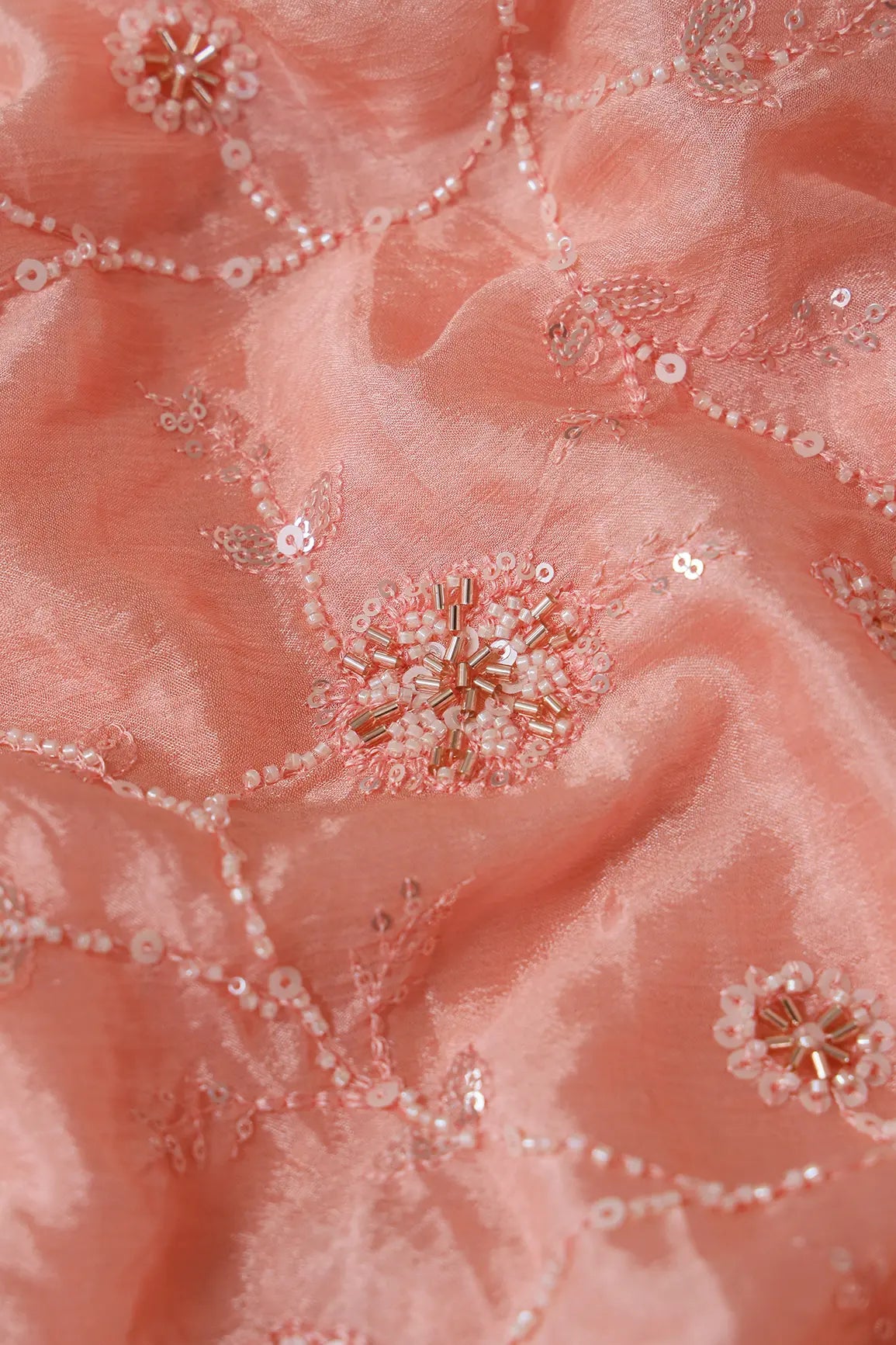 White Beads And Sequins Floral Embroidery On Peach Chinnon Chiffon Fabric