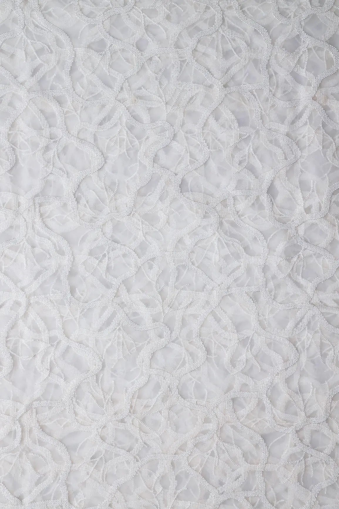 White Sequins Abstract Embroidery On White Dyeable Soft Net Fabric