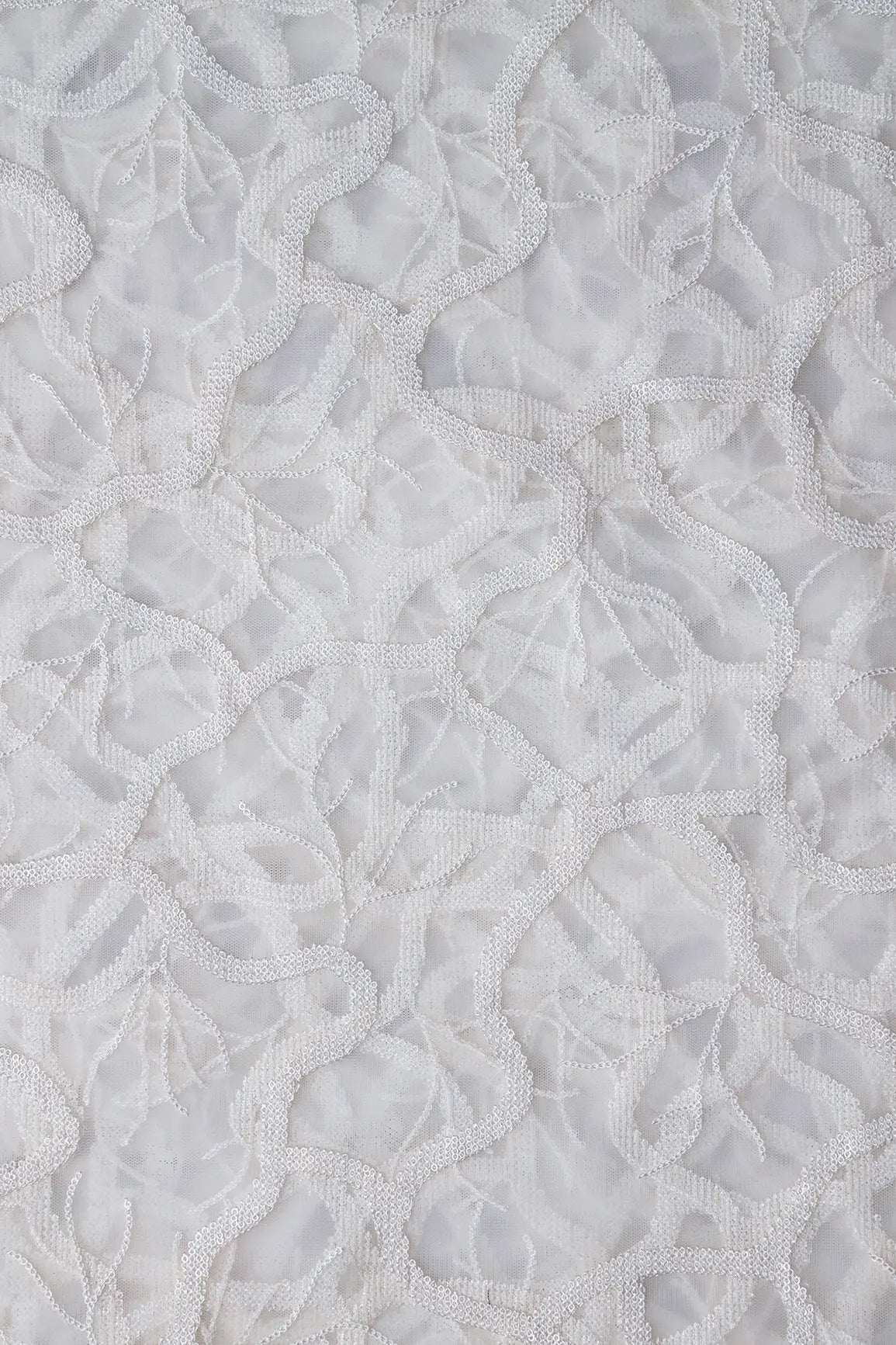 White Sequins Abstract Embroidery On White Dyeable Soft Net Fabric