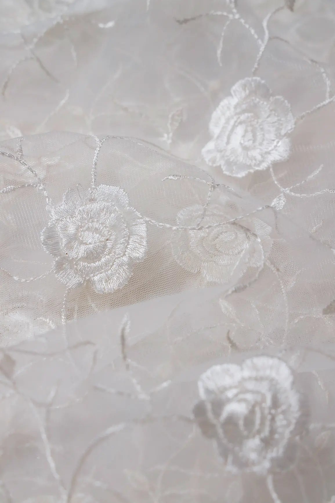 Water Sequins With White Thread Floral Embroidery On White Dyeable Soft Net Fabric