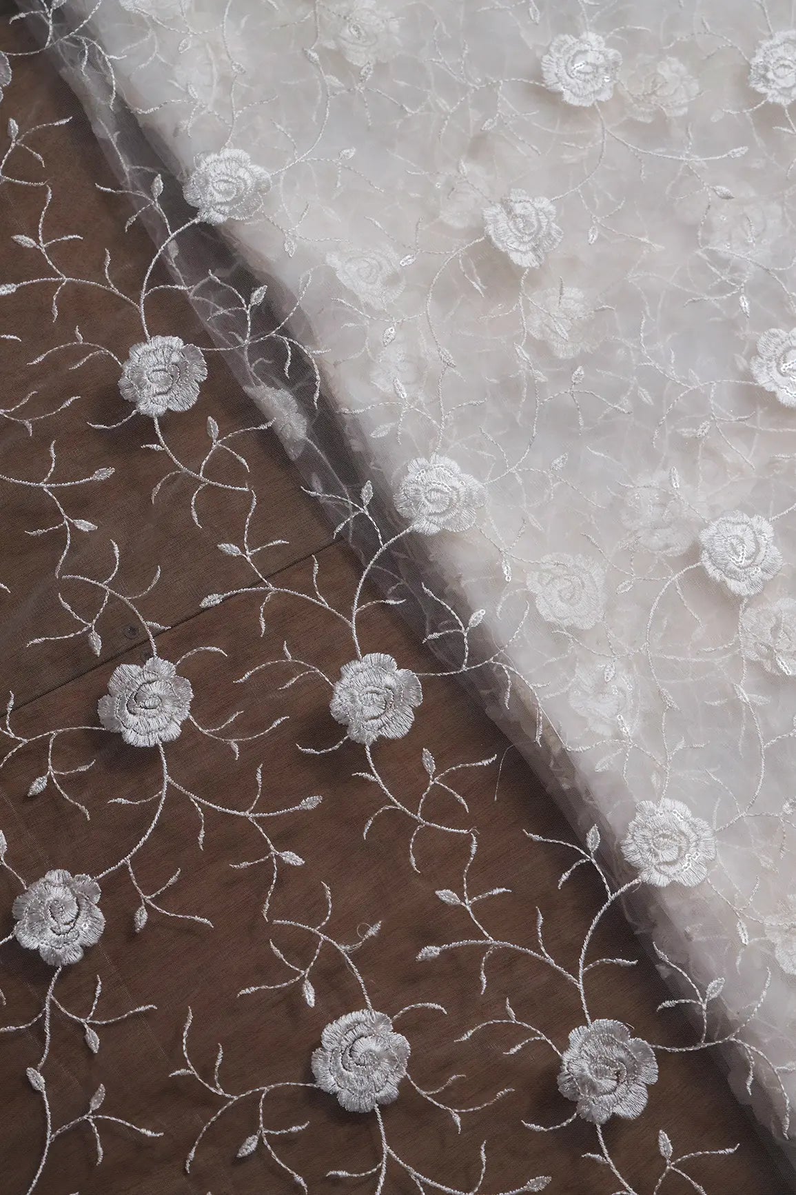 Water Sequins With White Thread Floral Embroidery On White Dyeable Soft Net Fabric