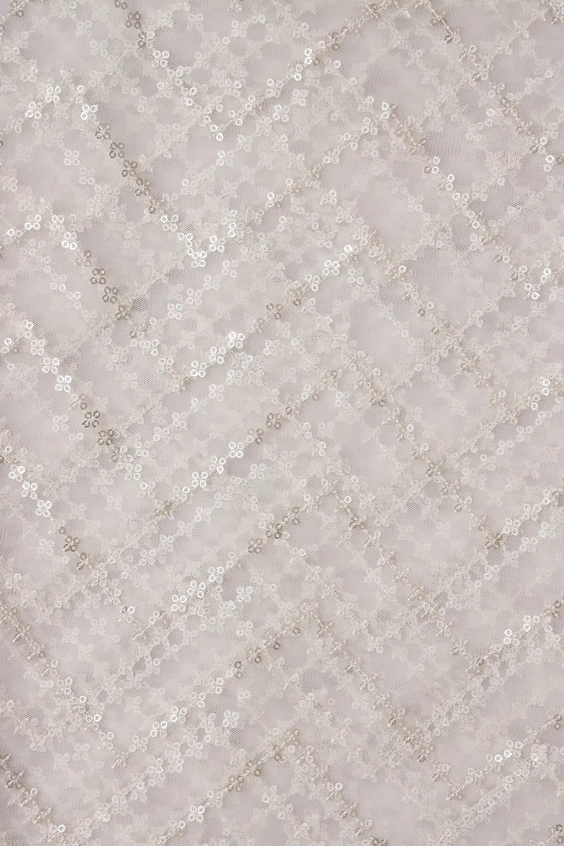 Silver Sequins Chevron Embroidery Work On White Dyeable Soft Net Fabric