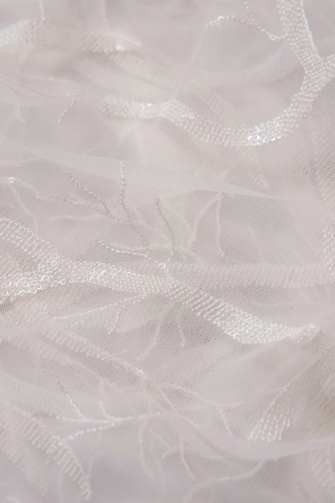 White Thread With Water Sequins Abstract Embroidery Work On Dyeable White Soft Net Fabric