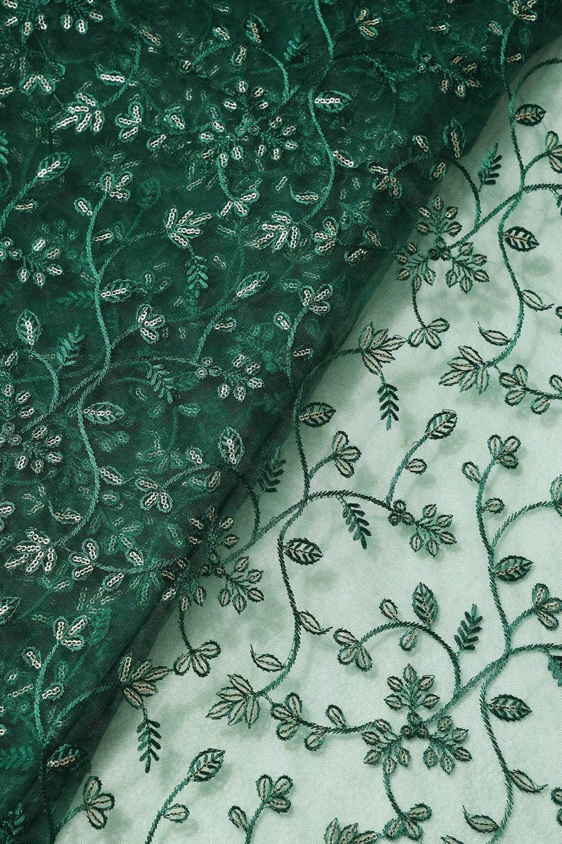 Beautiful Gold Glitter Sequins Heavy Floral Embroidery On Bottle Green Soft Net Fabric