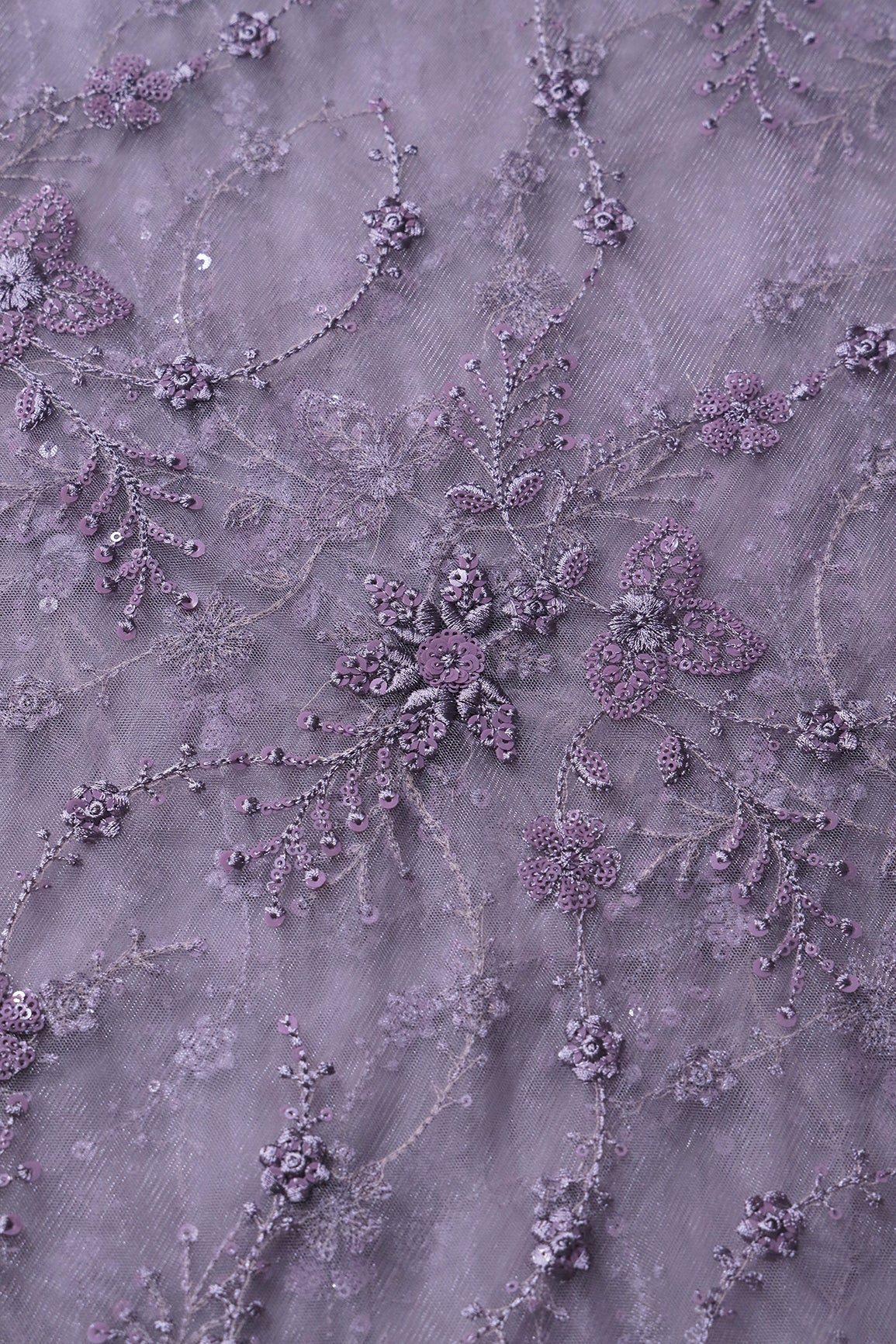 Beautiful Grey Thread With Sequins Floral Embroidery Work On Purple Grey Soft Net Fabric