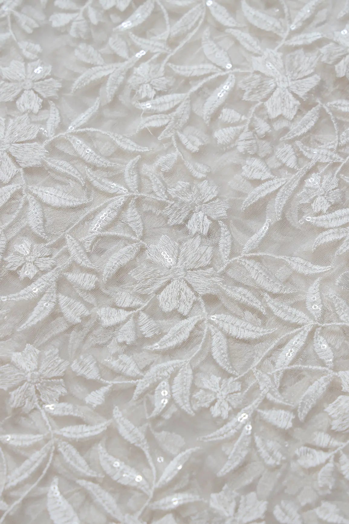 White Thread With Sequins Floral Heavy Embroidery On White Dyeable Soft Net Fabric