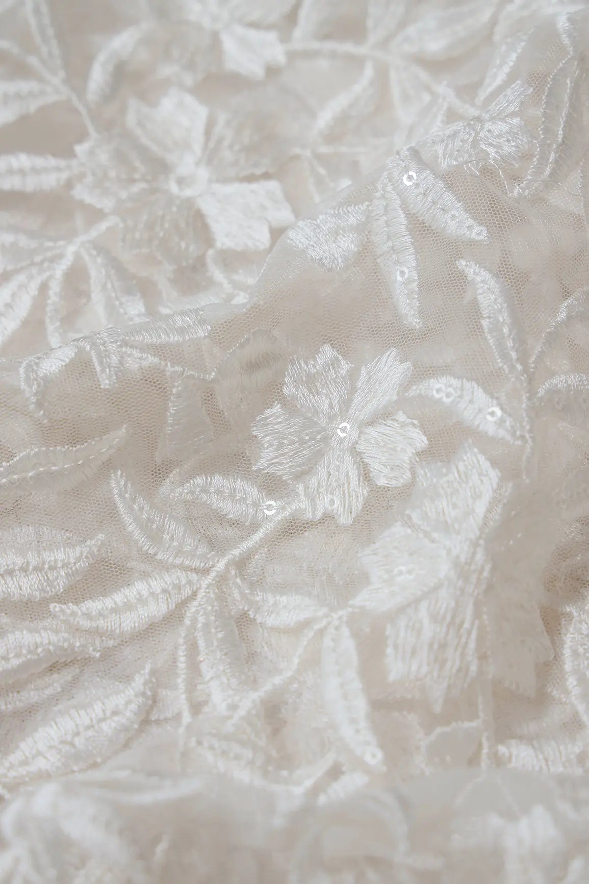 White Thread With Sequins Floral Heavy Embroidery On White Dyeable Soft Net Fabric