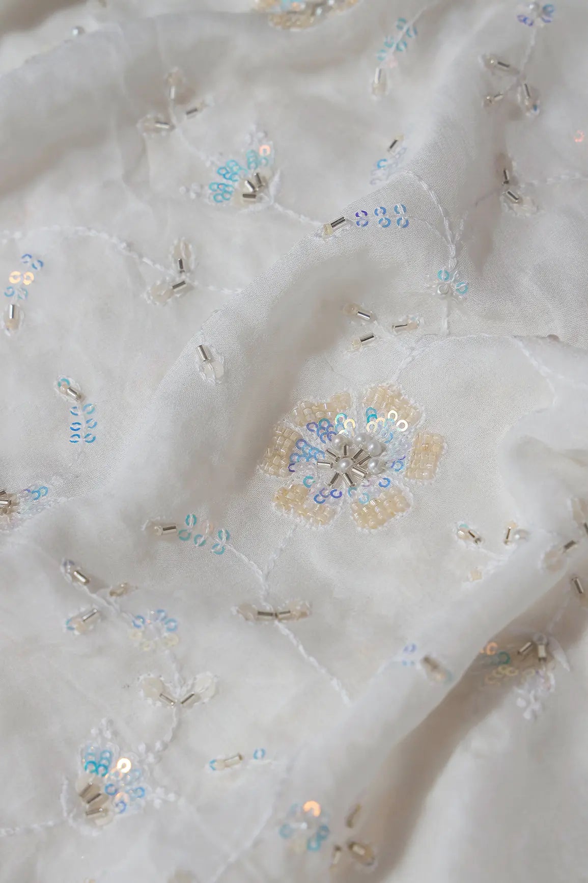 White Thread With Rainbow Sequins And Beads Floral Embroidery On White Viscose Georgette Fabric