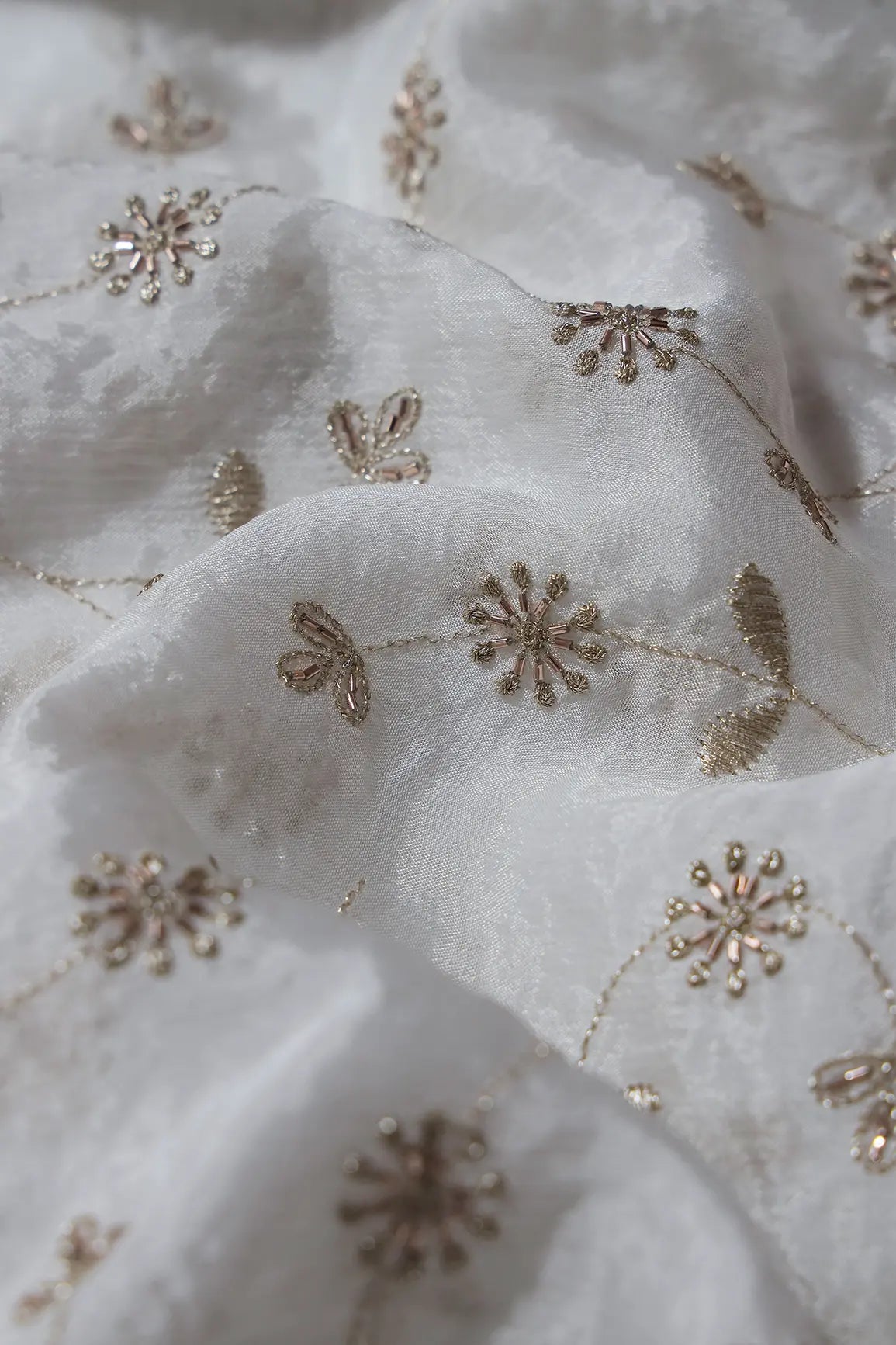 Gold Zari With Beads Floral Embroidery Work On White Dyeable Chinnon Chiffon Fabric