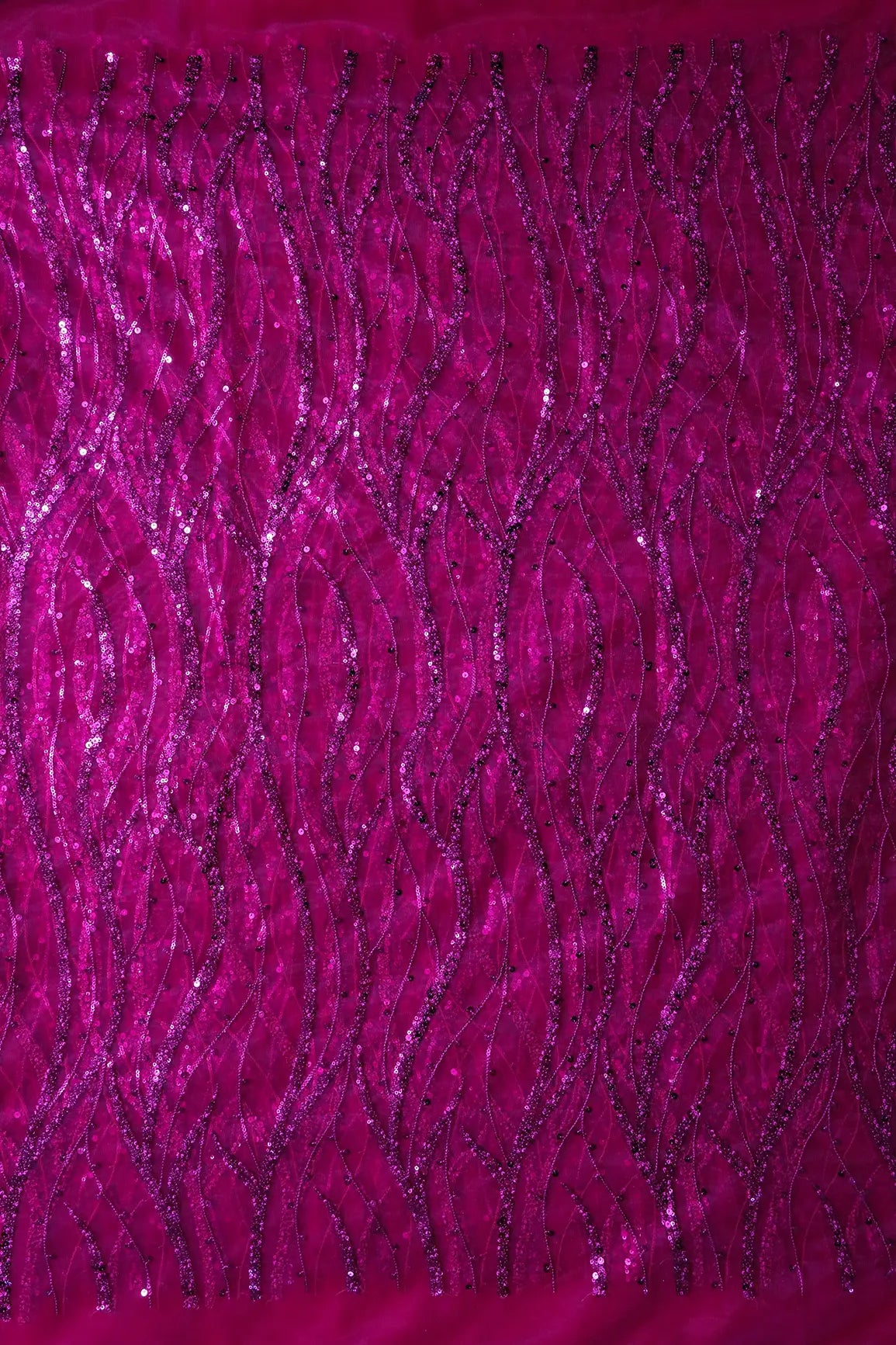 Beautiful Sequins With Fuchsia Thread Wavy Embroidery Work On Fuchsia Soft Net Fabric