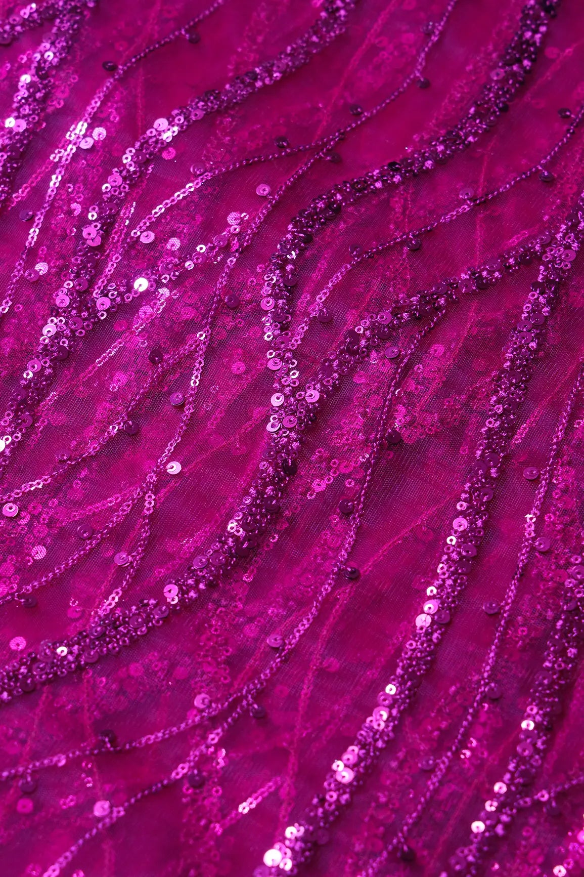 Beautiful Sequins With Fuchsia Thread Wavy Embroidery Work On Fuchsia Soft Net Fabric