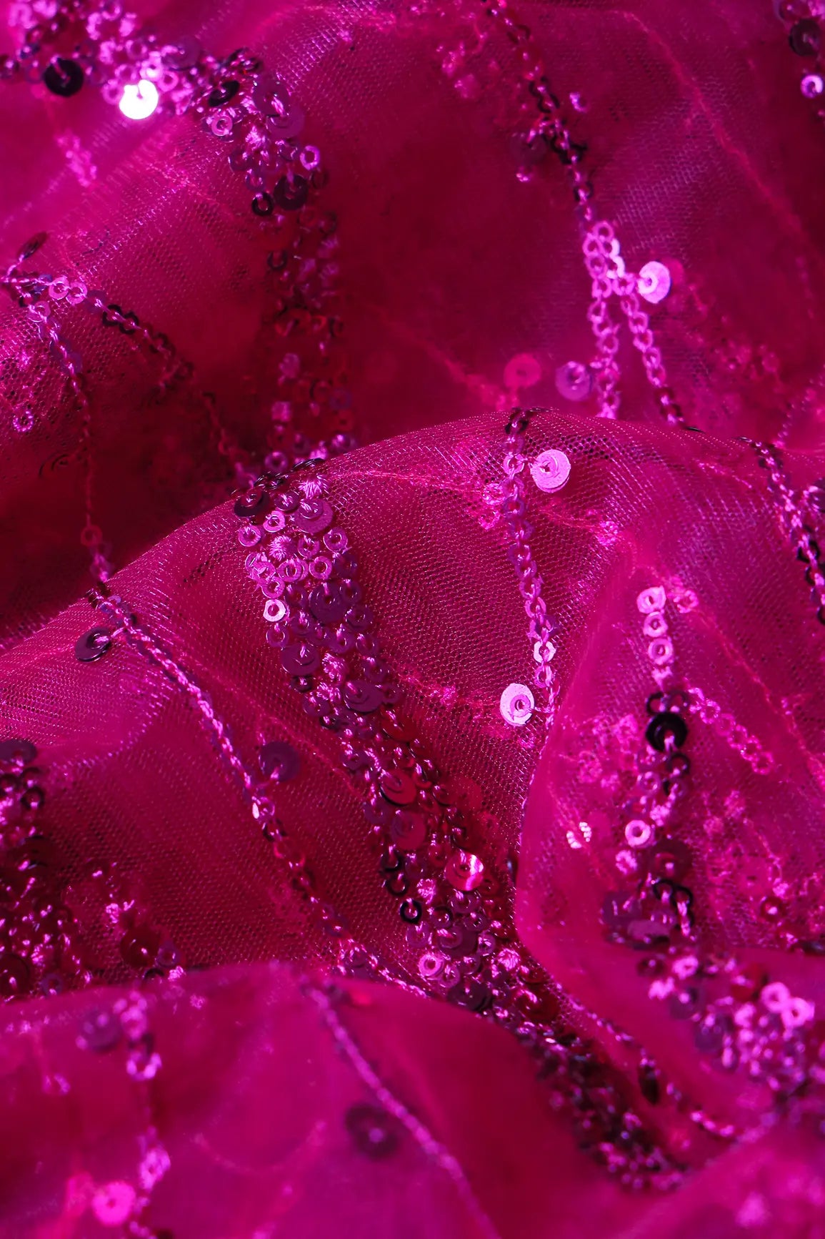 Beautiful Sequins With Fuchsia Thread Wavy Embroidery Work On Fuchsia Soft Net Fabric