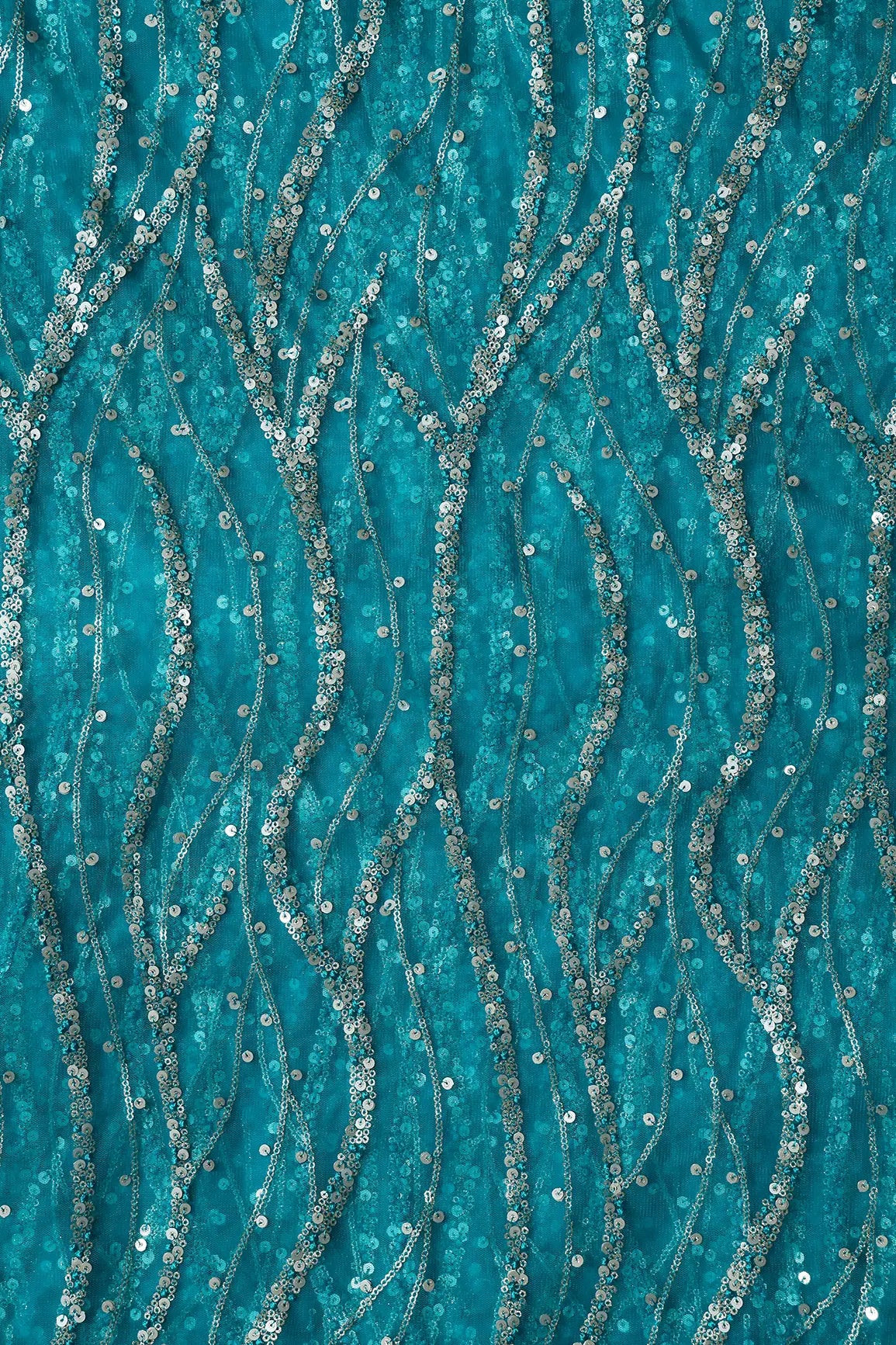 Gold And Silver Sequins With Peacock Blue Thread Wavy Embroidery On Peacock Blue Soft Net Fabric