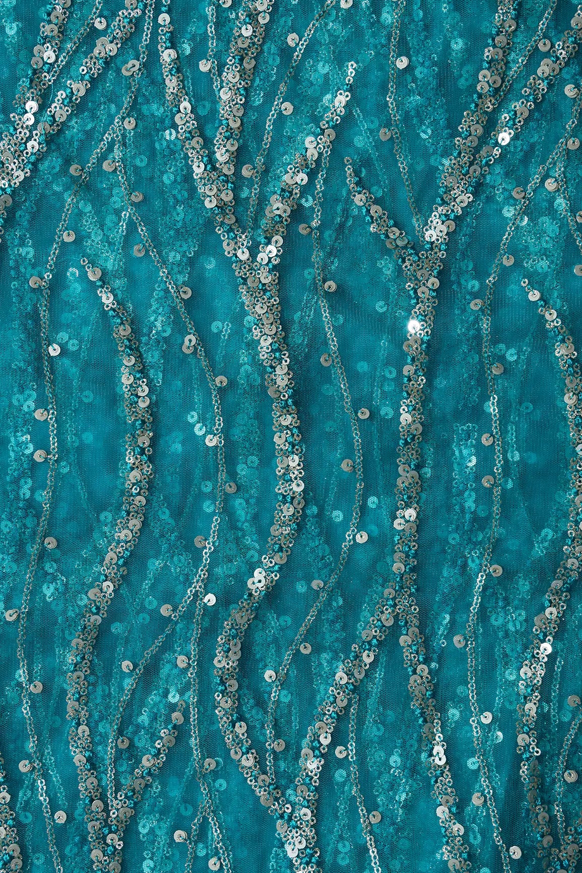 Gold And Silver Sequins With Peacock Blue Thread Wavy Embroidery On Peacock Blue Soft Net Fabric