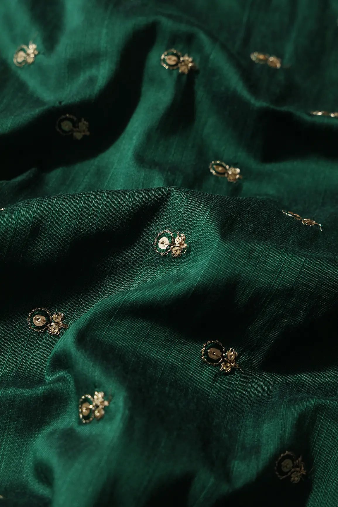 Green Thread With Gold Sequins Small Floral Booti Embroidery On Bottle Green Raw Silk Fabric