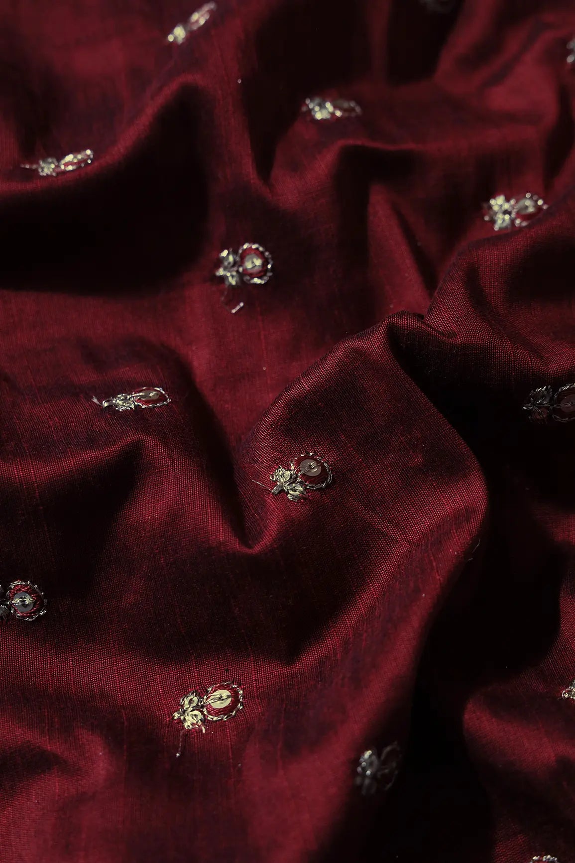 Maroon Thread With Gold Sequins Small Floral Booti Embroidery On Maroon Raw Silk Fabric