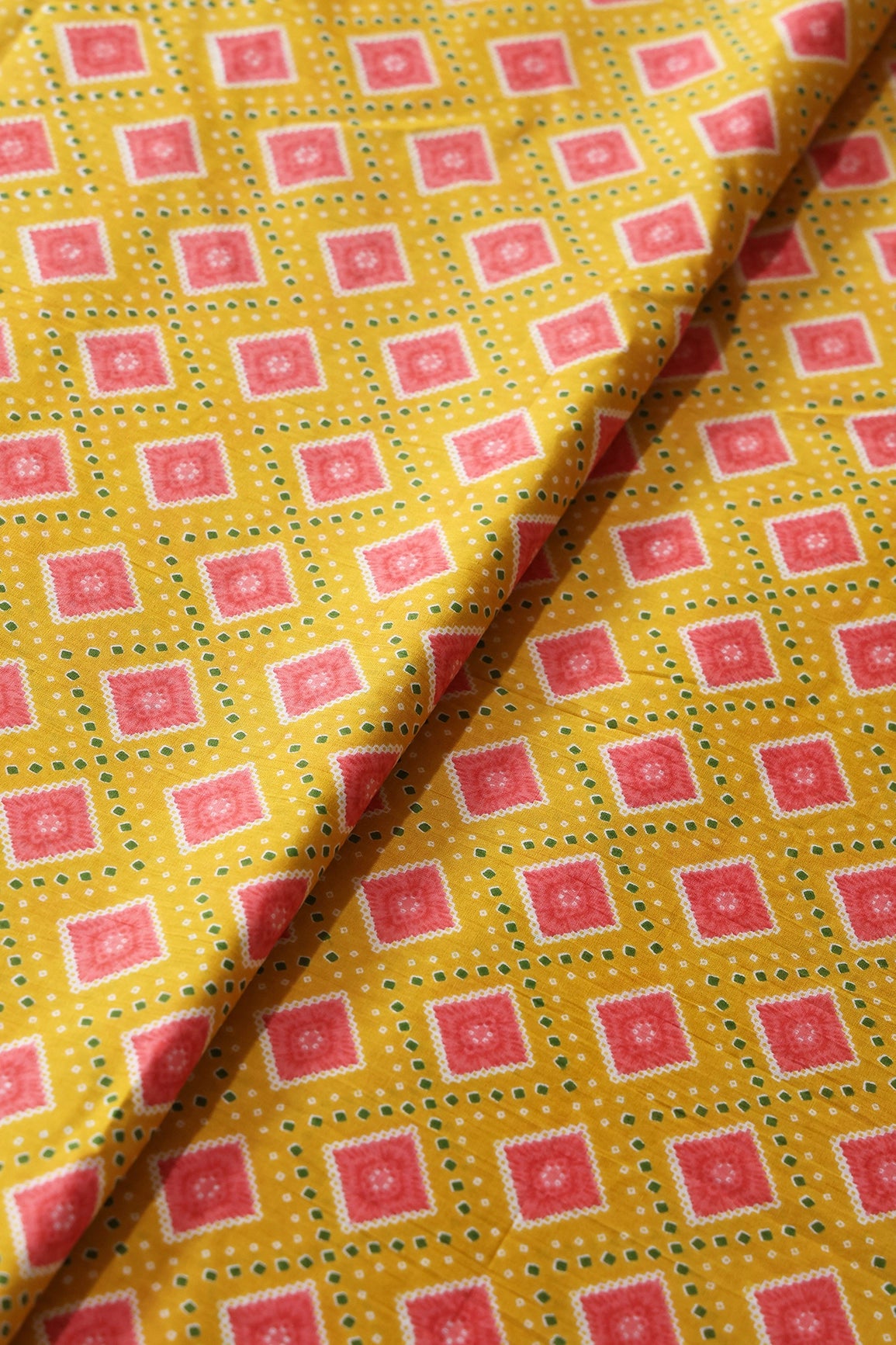 Yellow And Pink Bandhani Print On Pure Cotton Fabric