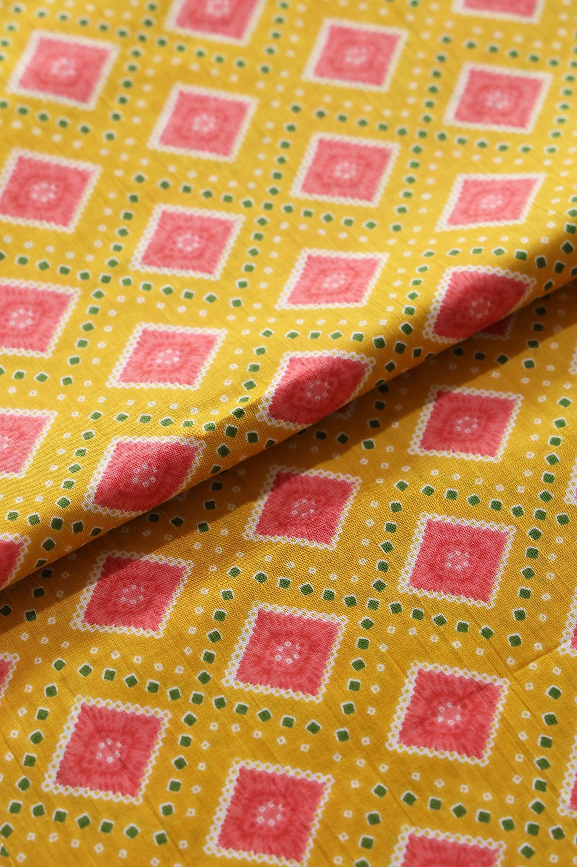 Yellow And Pink Bandhani Print On Pure Cotton Fabric