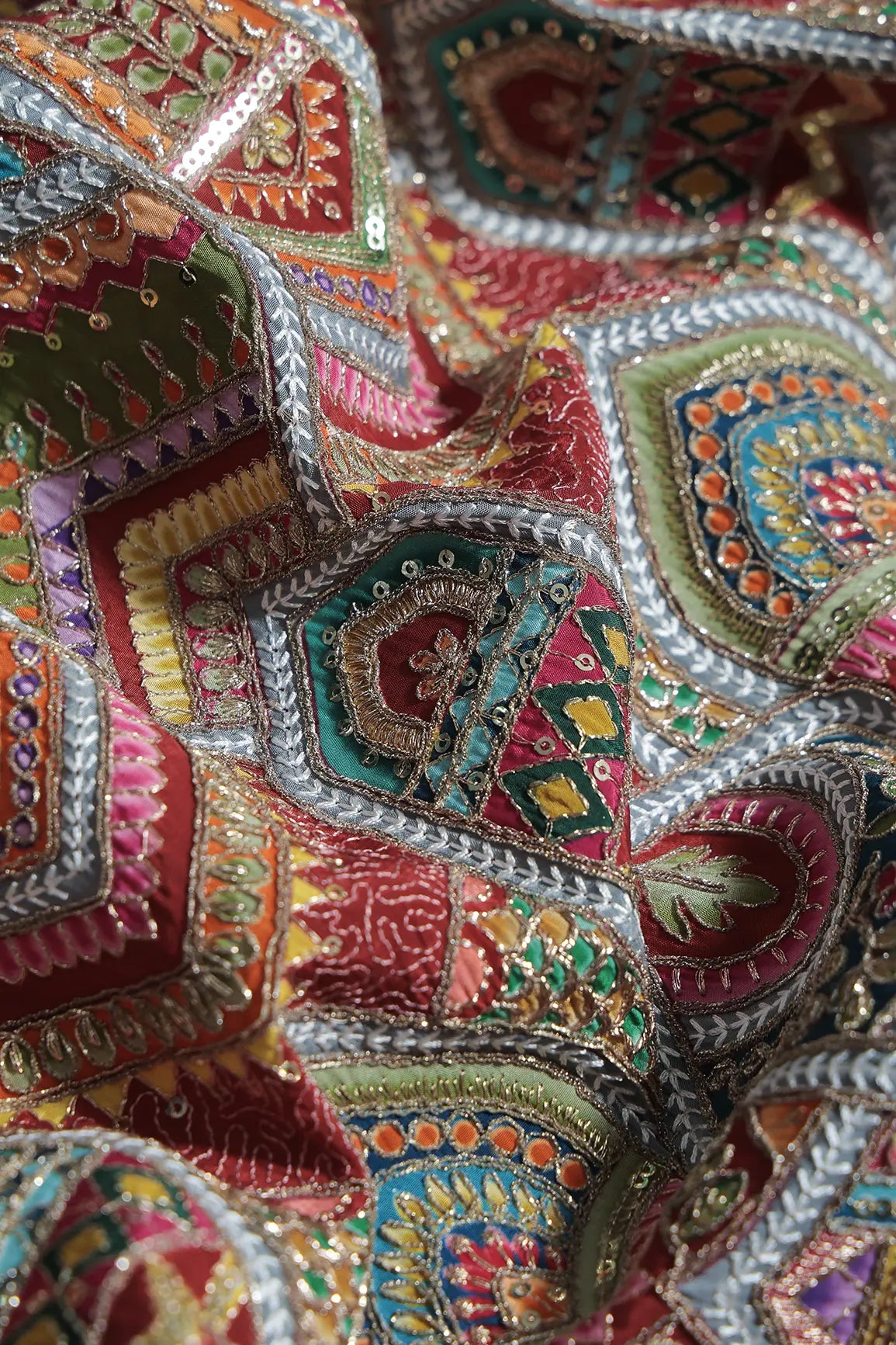 Zari & Sequins With Multi Color Geometric Print Heavy Embroidery Work On Maroon Pure Crepe Fabric