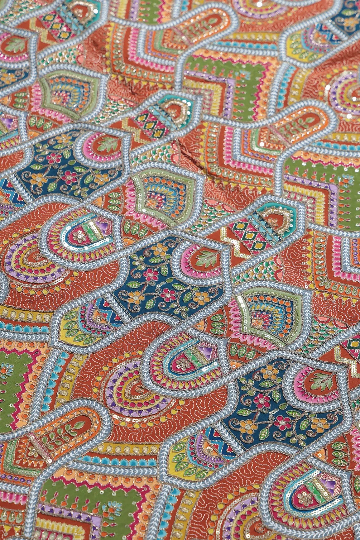 Zari & Sequins With Multi Color Geometric Print Heavy Embroidery Work On Rust Pure Crepe Fabric