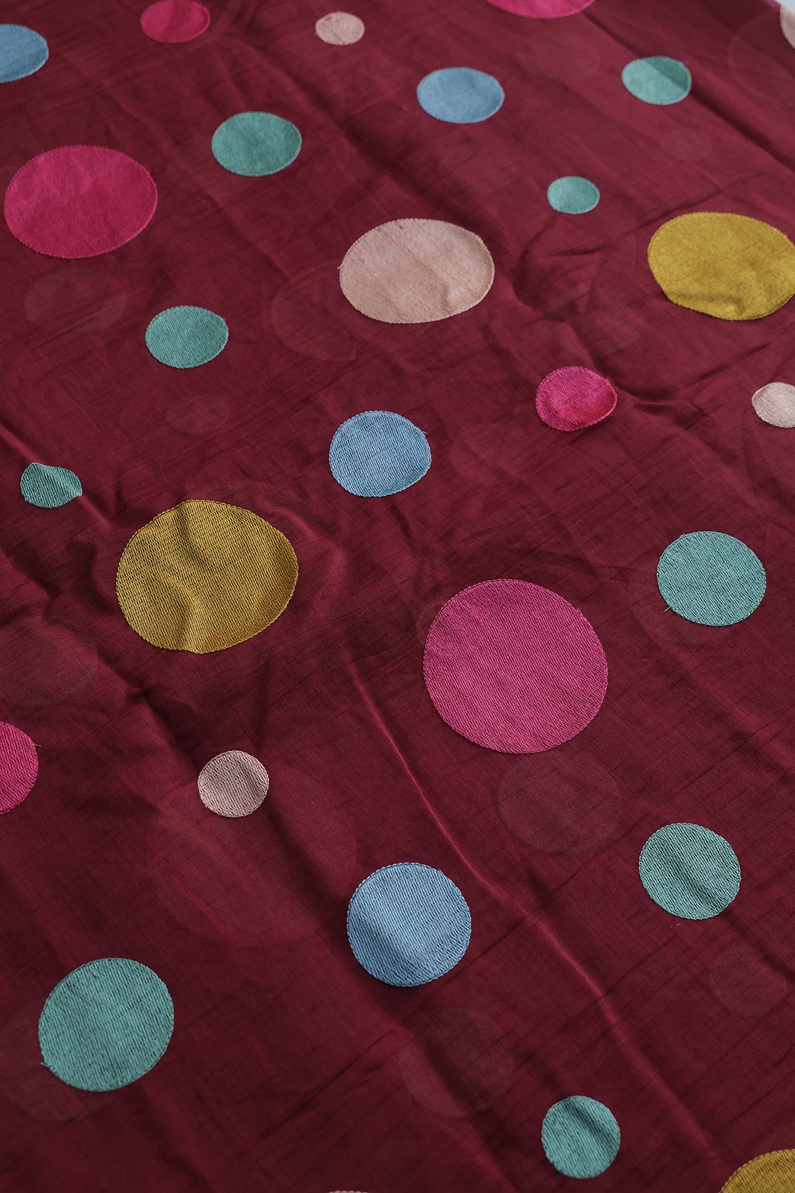 Multi Thread Circle Embroidery On Maroon Pure Mul Chanderi Silk Fabric