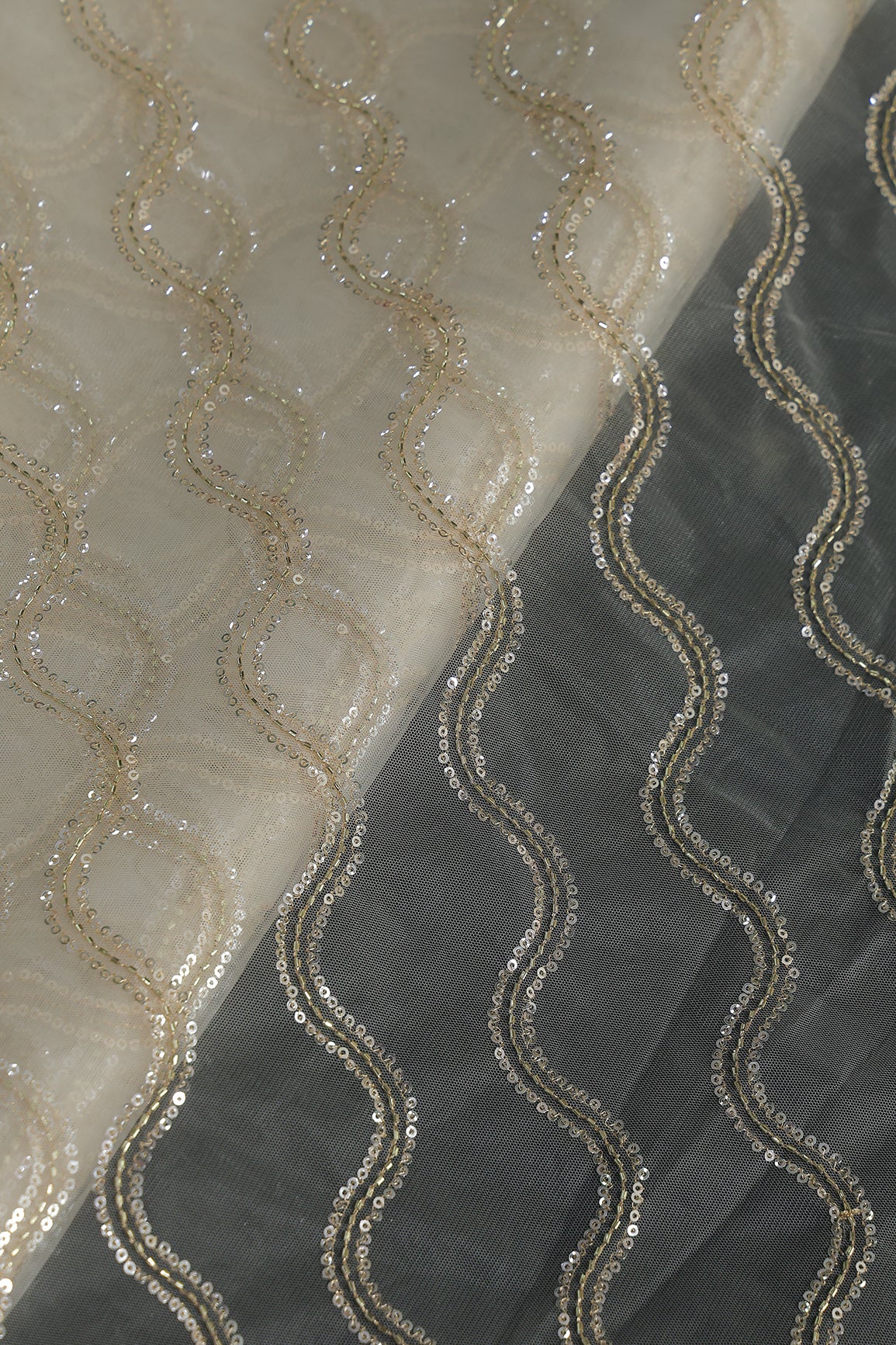 Leheriya Embroidery Work With Sequins And Beads On Cream Soft Net Fabric