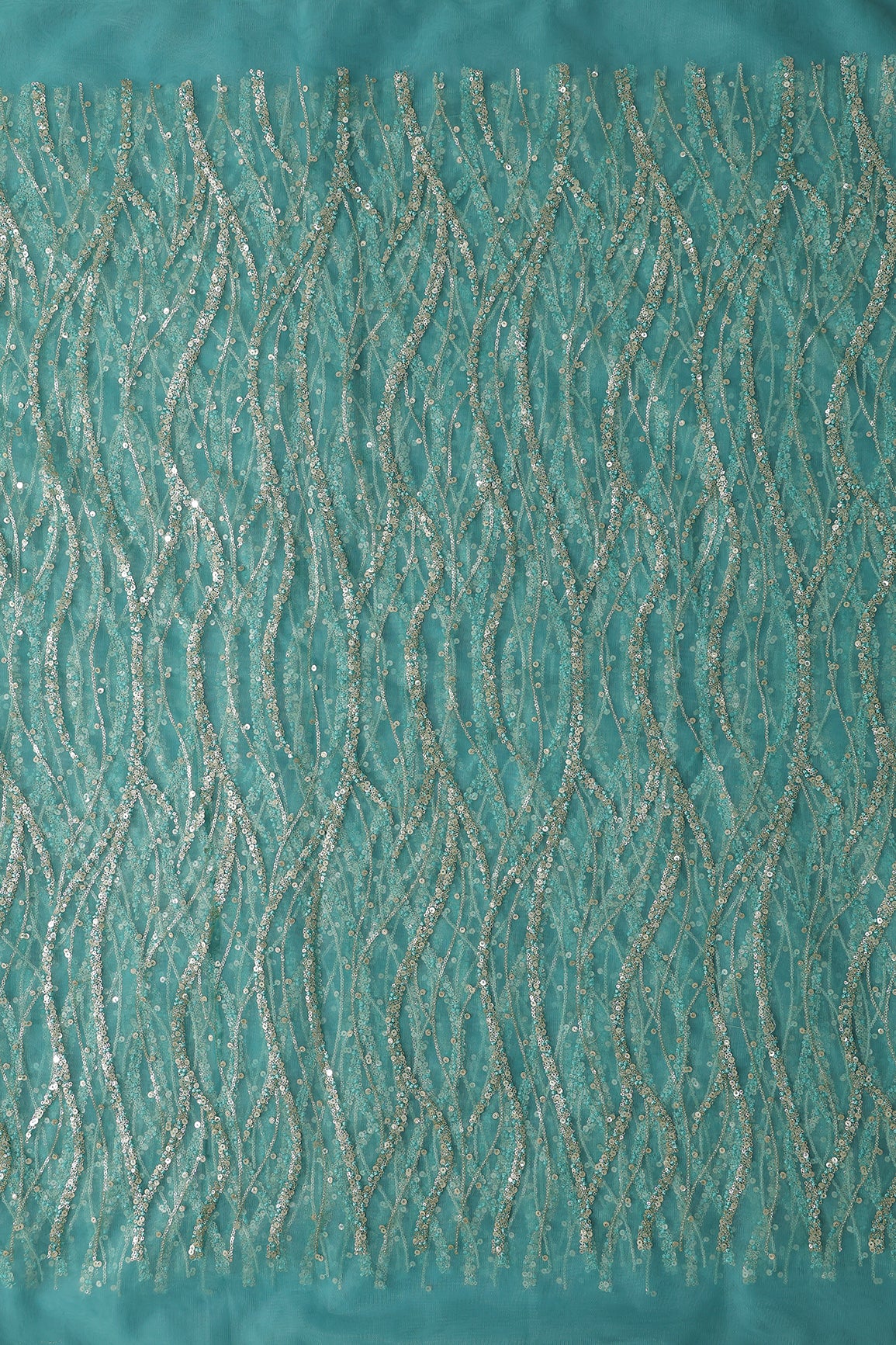 Gold And Silver Sequins With Teal Thread Wavy Embroidery Work On Teal Soft Net Fabric