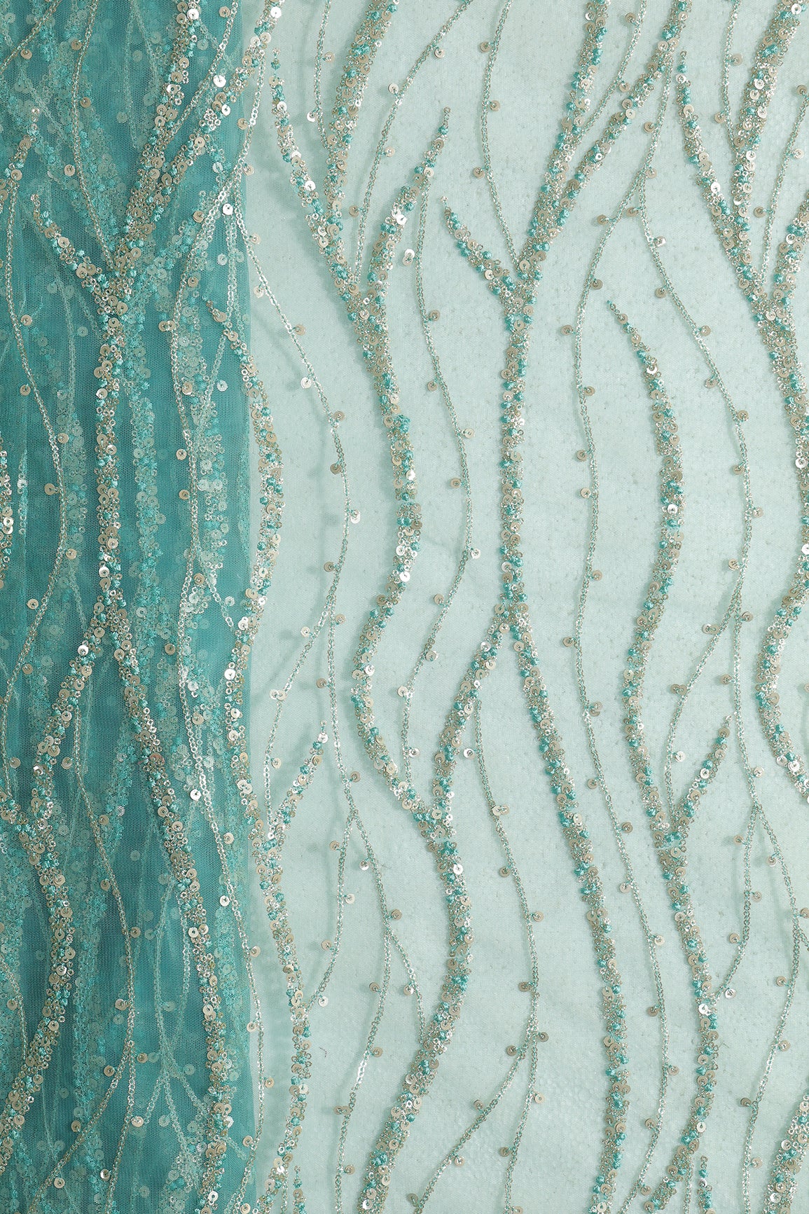 Gold And Silver Sequins With Teal Thread Wavy Embroidery Work On Teal Soft Net Fabric
