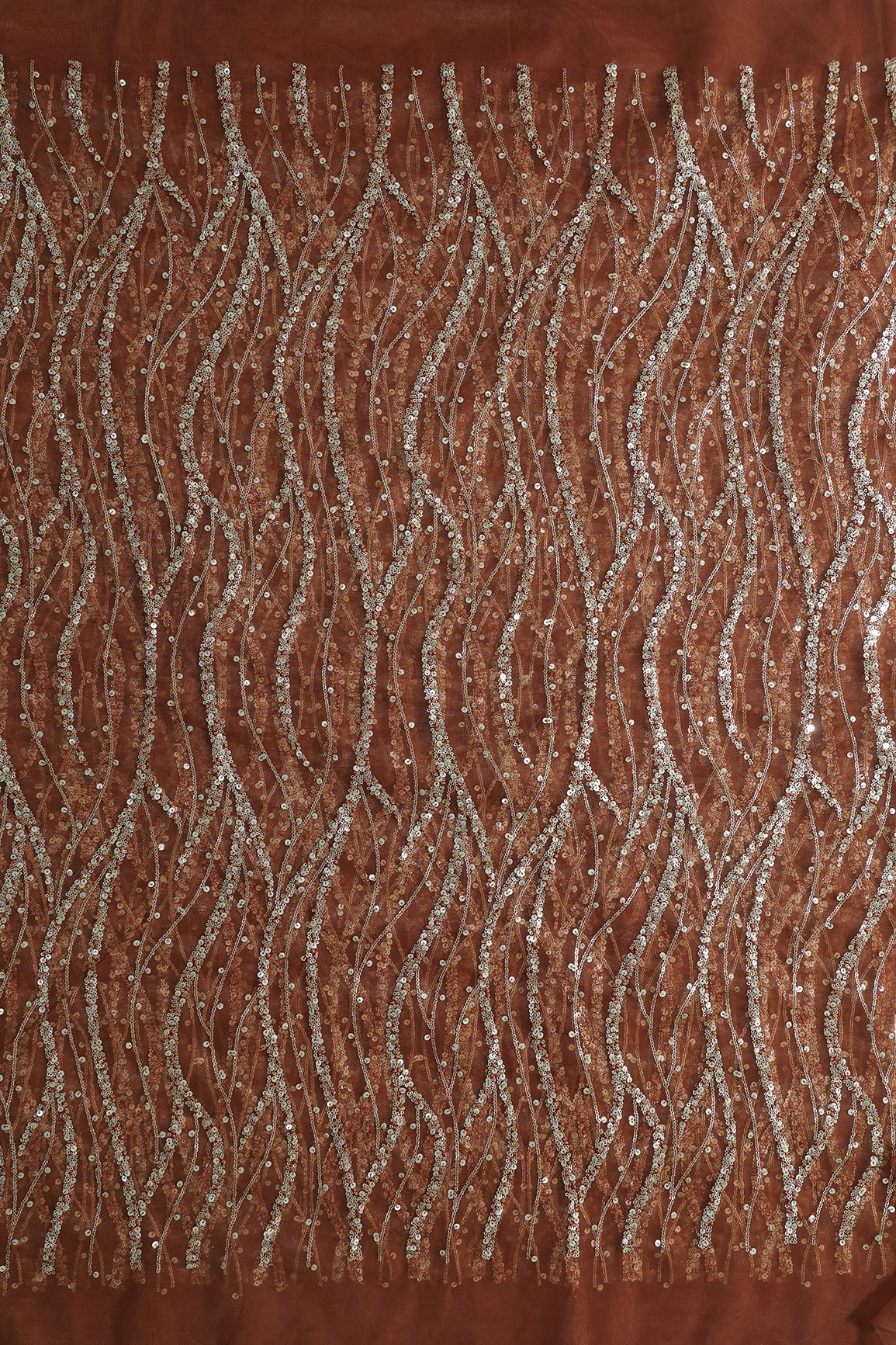 Gold And Silver Sequins With Brown Thread Wavy Embroidery Work On Brown Soft Net Fabric