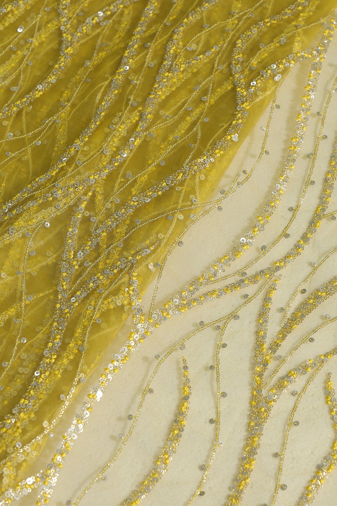 Gold And Silver Sequins With Lemon Yellow Thread Wavy Embroidery Work On Lemon Yellow Soft Net Fabric
