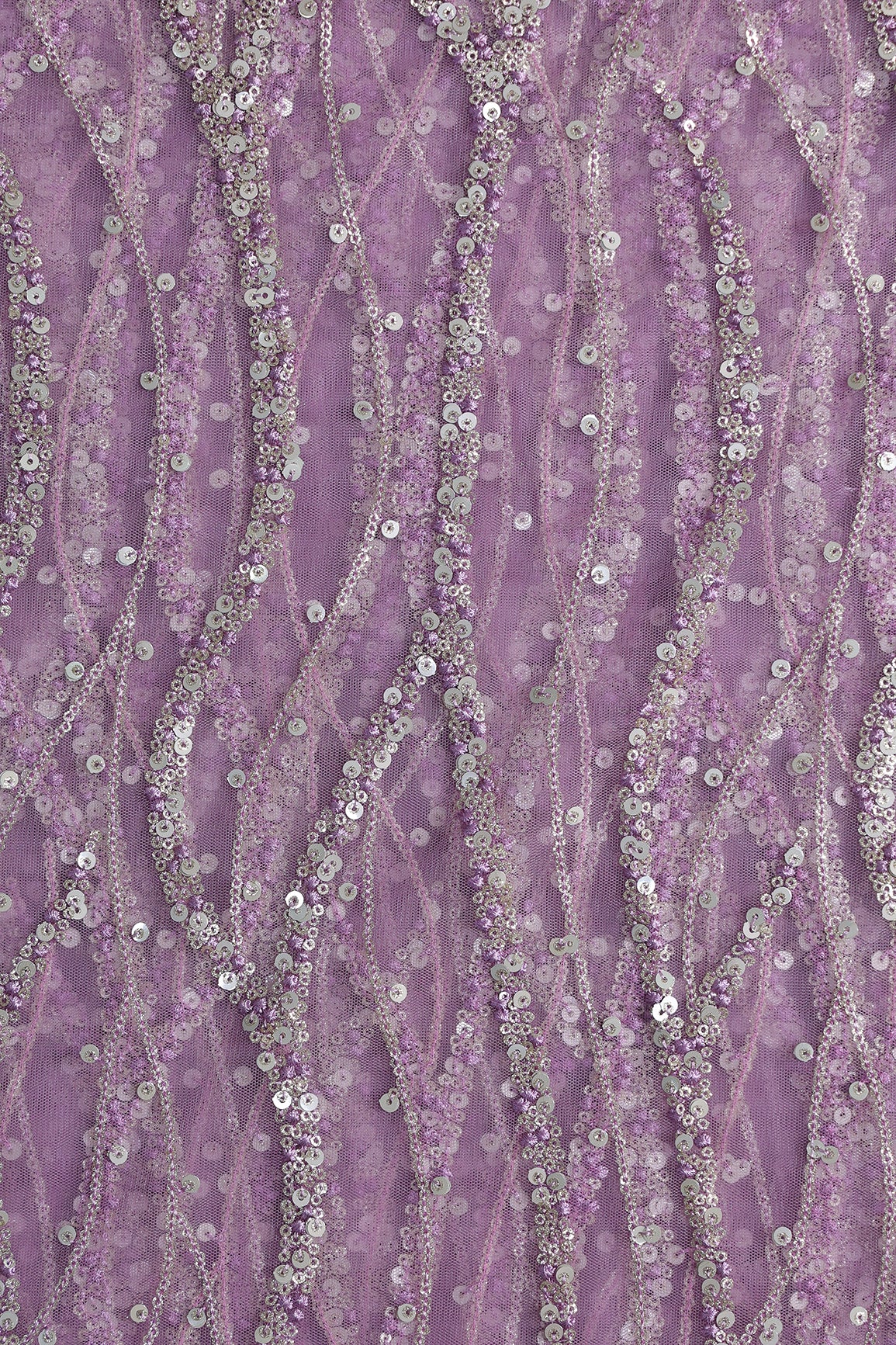 Gold And Silver Sequins With Lavender Thread Wavy Embroidery Work On Lavender Soft Net Fabric