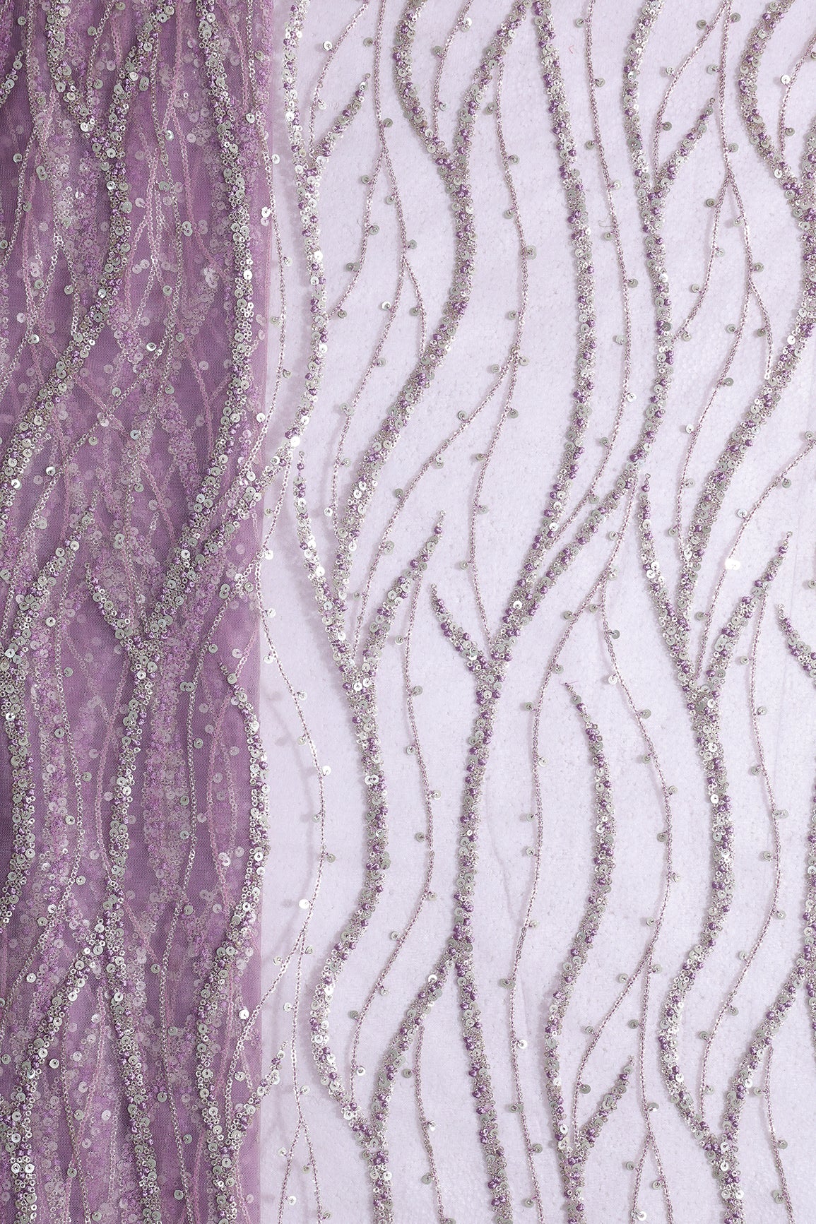 Gold And Silver Sequins With Lavender Thread Wavy Embroidery Work On Lavender Soft Net Fabric