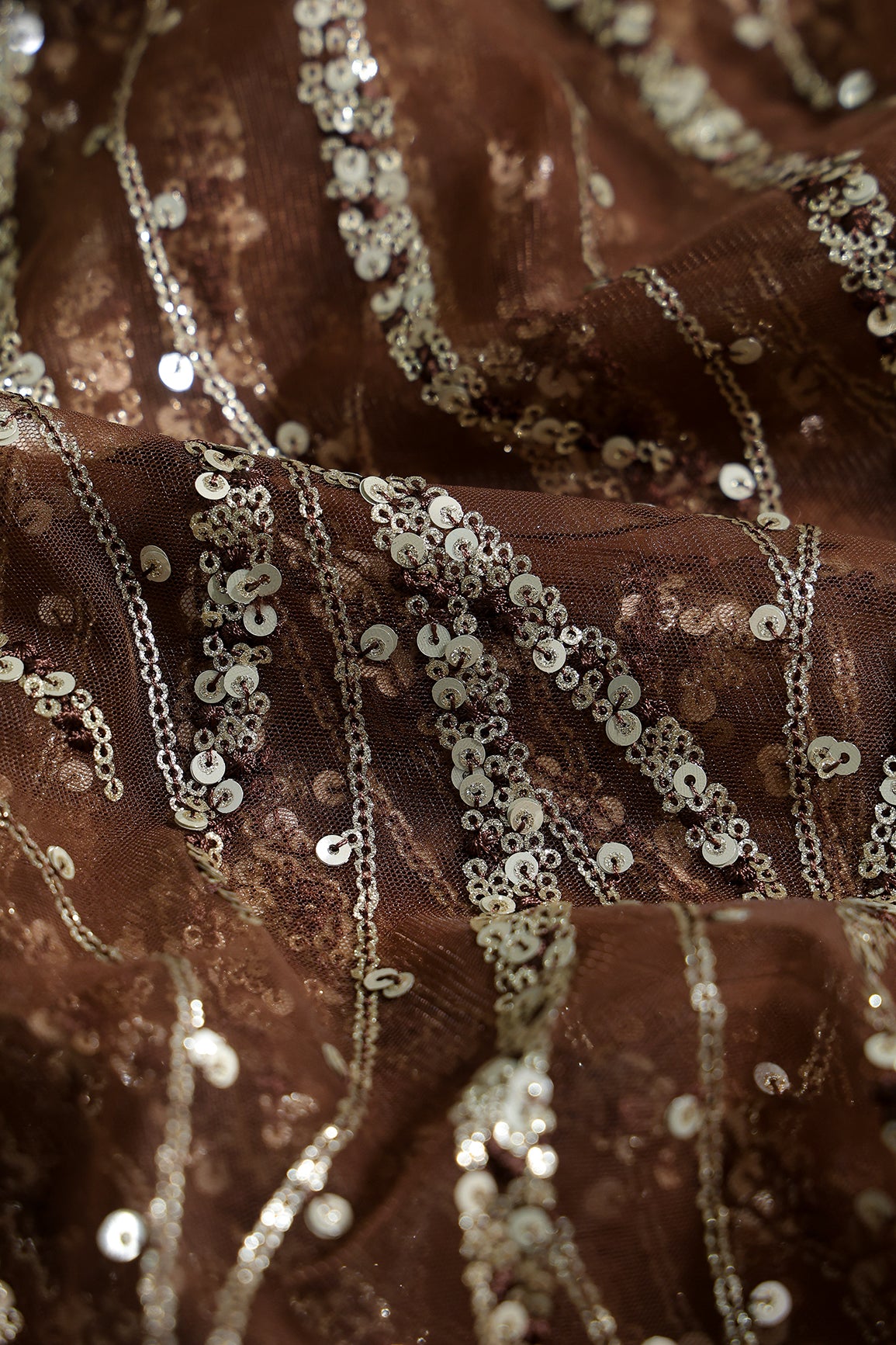 Gold And Silver Sequins With Coffee Thread Wavy Embroidery Work On Coffee Soft Net Fabric