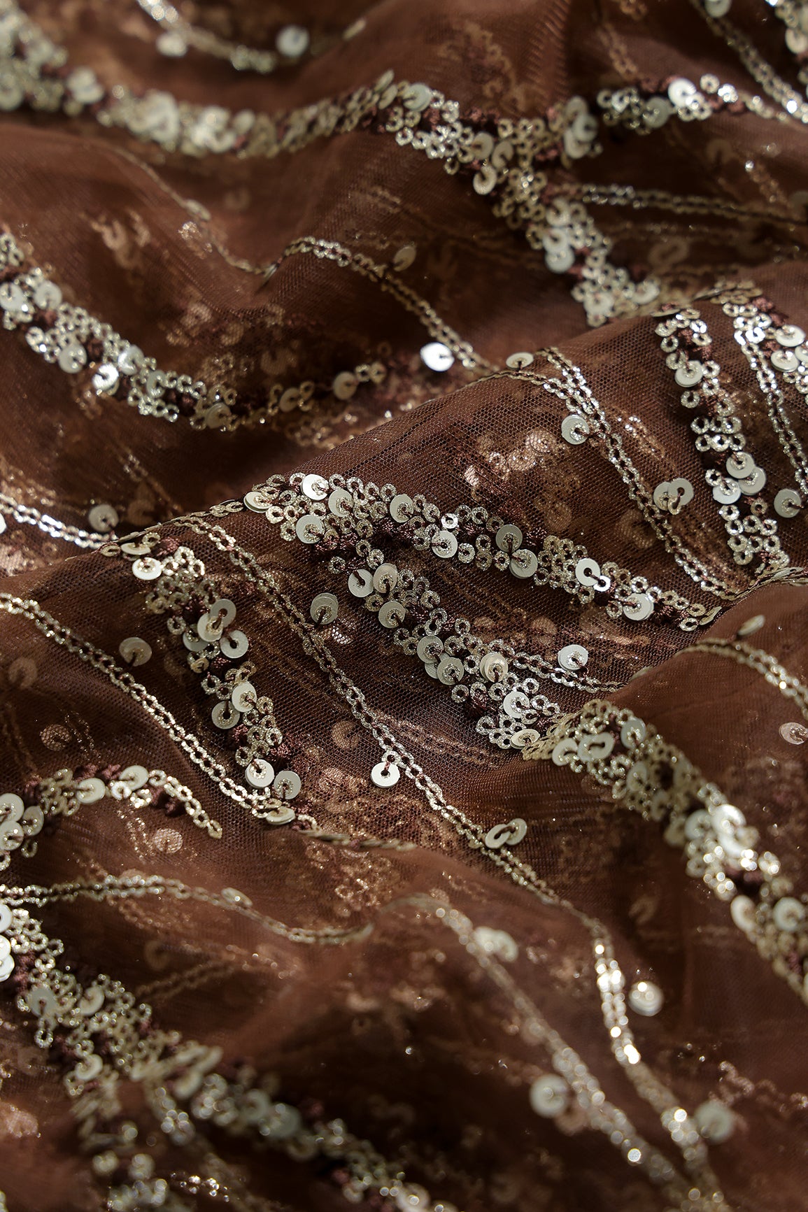 Gold And Silver Sequins With Coffee Thread Wavy Embroidery Work On Coffee Soft Net Fabric