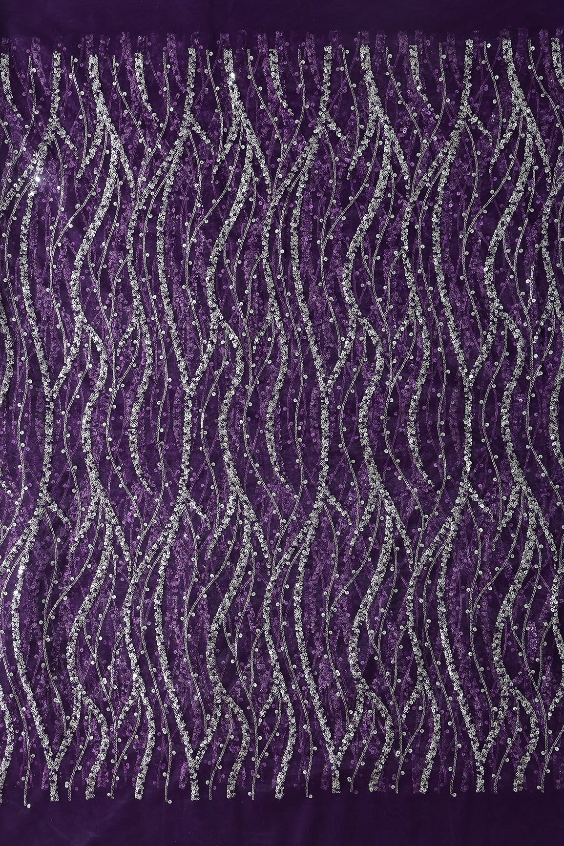 Gold And Silver Sequins With Purple Thread Wavy Embroidery Work On Purple Soft Net Fabric
